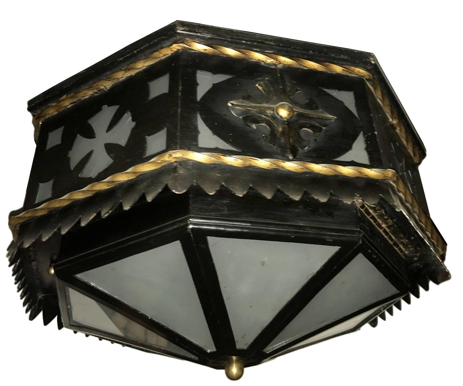 A single 1940s wrought iron flush mounted light fixture with painted and gilt finish, frosted glass insets.
Measurements
Diameter: 19