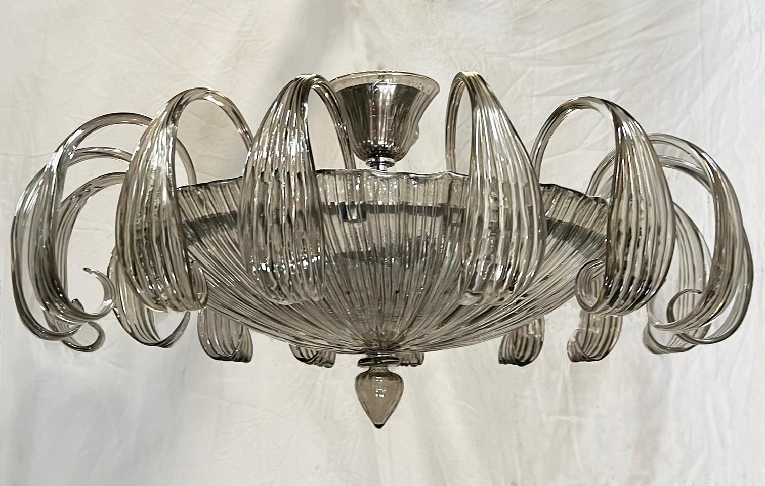 A circa 1960's Italian blown Murano smoke glass chandelier with six interior lights.

Measurements:
Diameter: 30