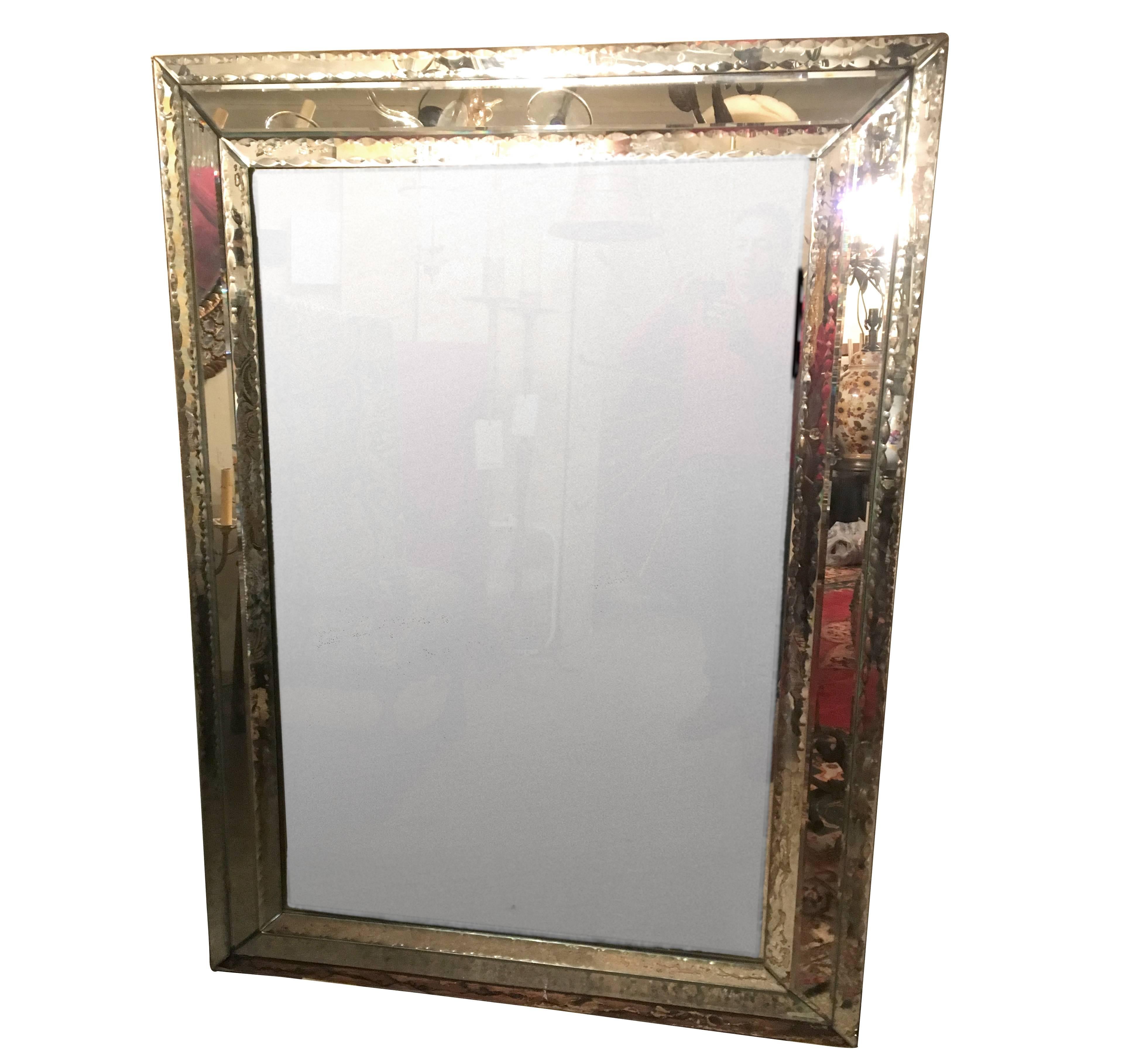 A pair of large circa 1960’s etched and beveled rectangular Venetian mirror.

Measurements:
Height: 60