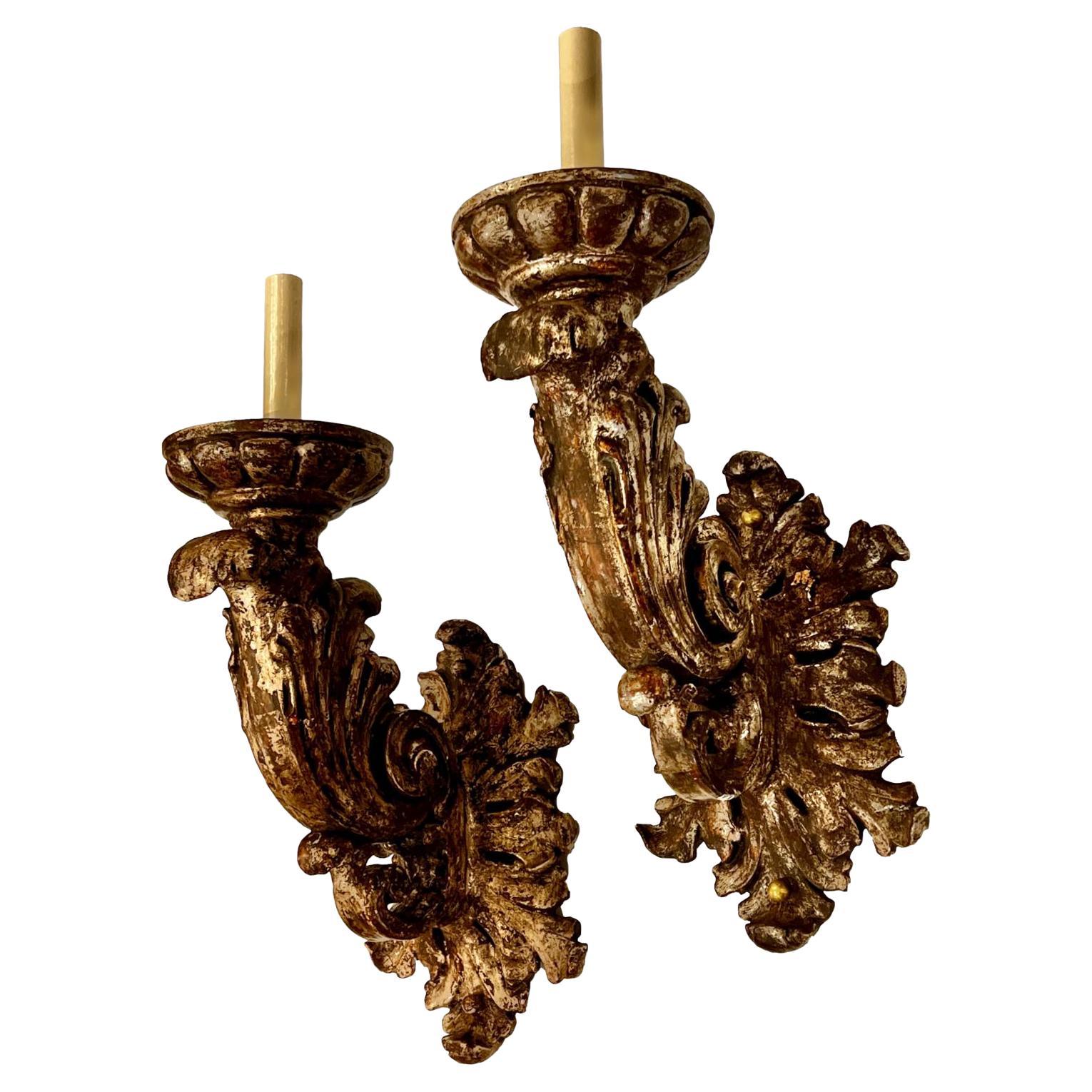 A set of Italian Carved and Silver Wood Sconces, Sold per Pair