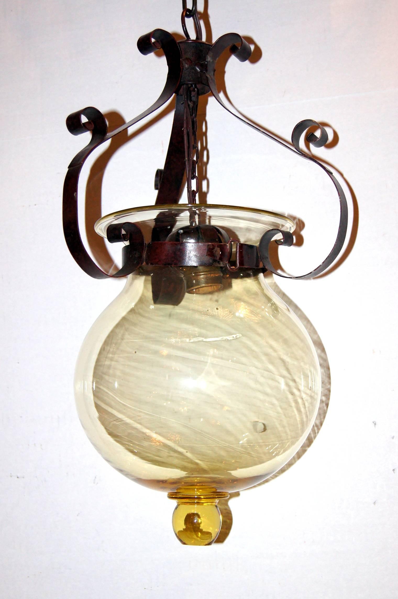 A circa 1920’s  blown glass Venetian lantern with hammered metal body.

Measurements:
Drop: 20″
Diameter: 7.75″.