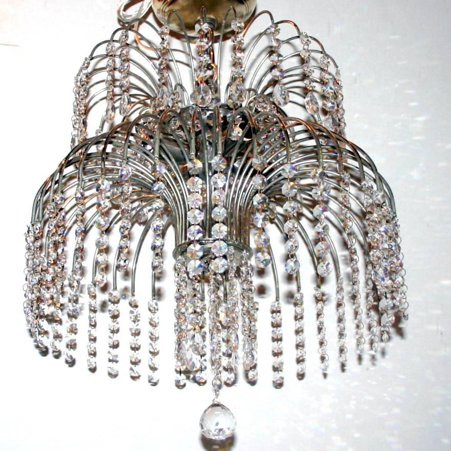 A circa 1950s French nickel-plated light fixture with crystal pendants, four lights.