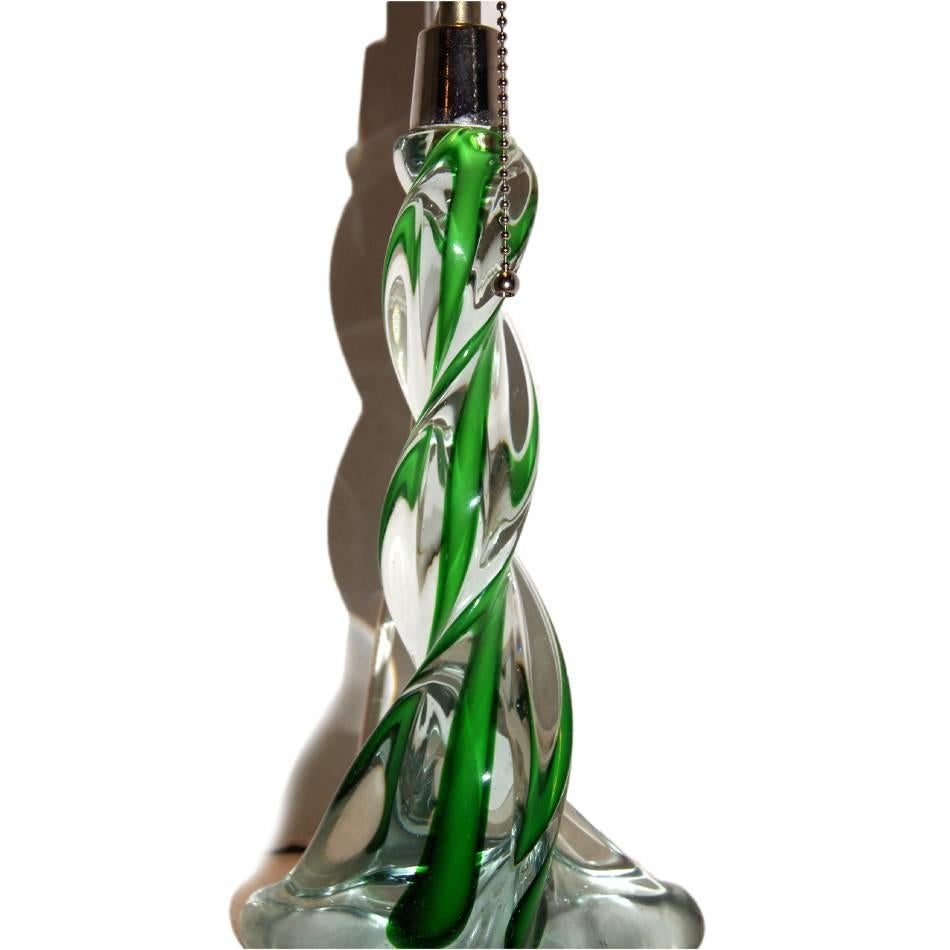 Pair of circa 1930's Murano glass table lamps of clear and green color.

Measurements:
Height of body: 11
