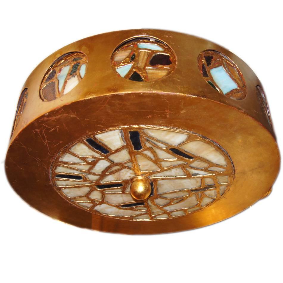 A circa 1940's French leaded glass and gilt light fixture with glass medallions on sides and interior lights.

Measurements:
Diameter: 23.5