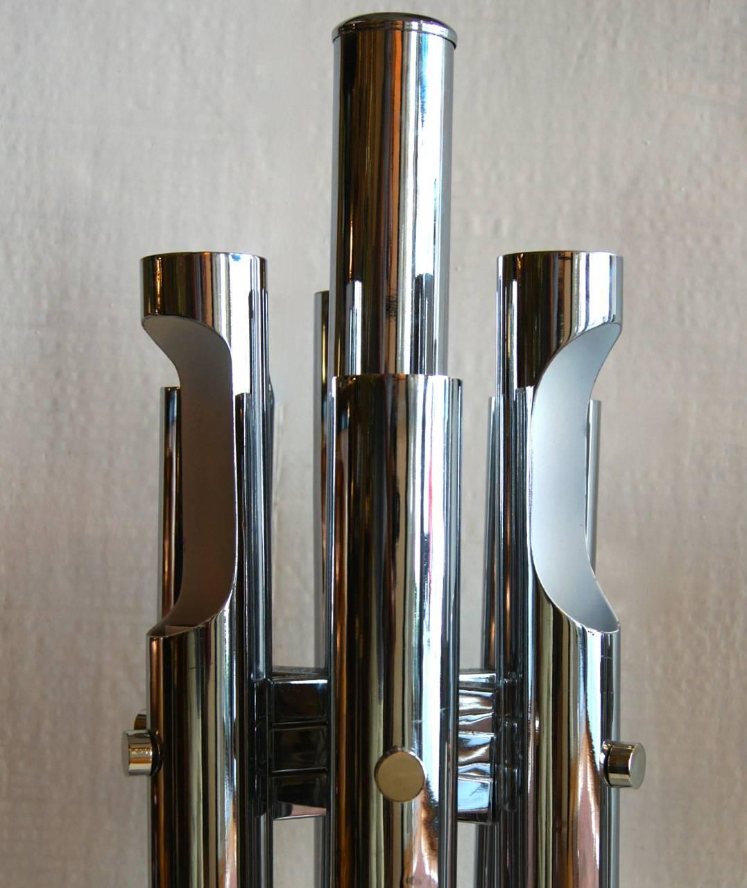 A pair of circa 1960s Italian chrome-plated moderne table lamps.
12 lights each.