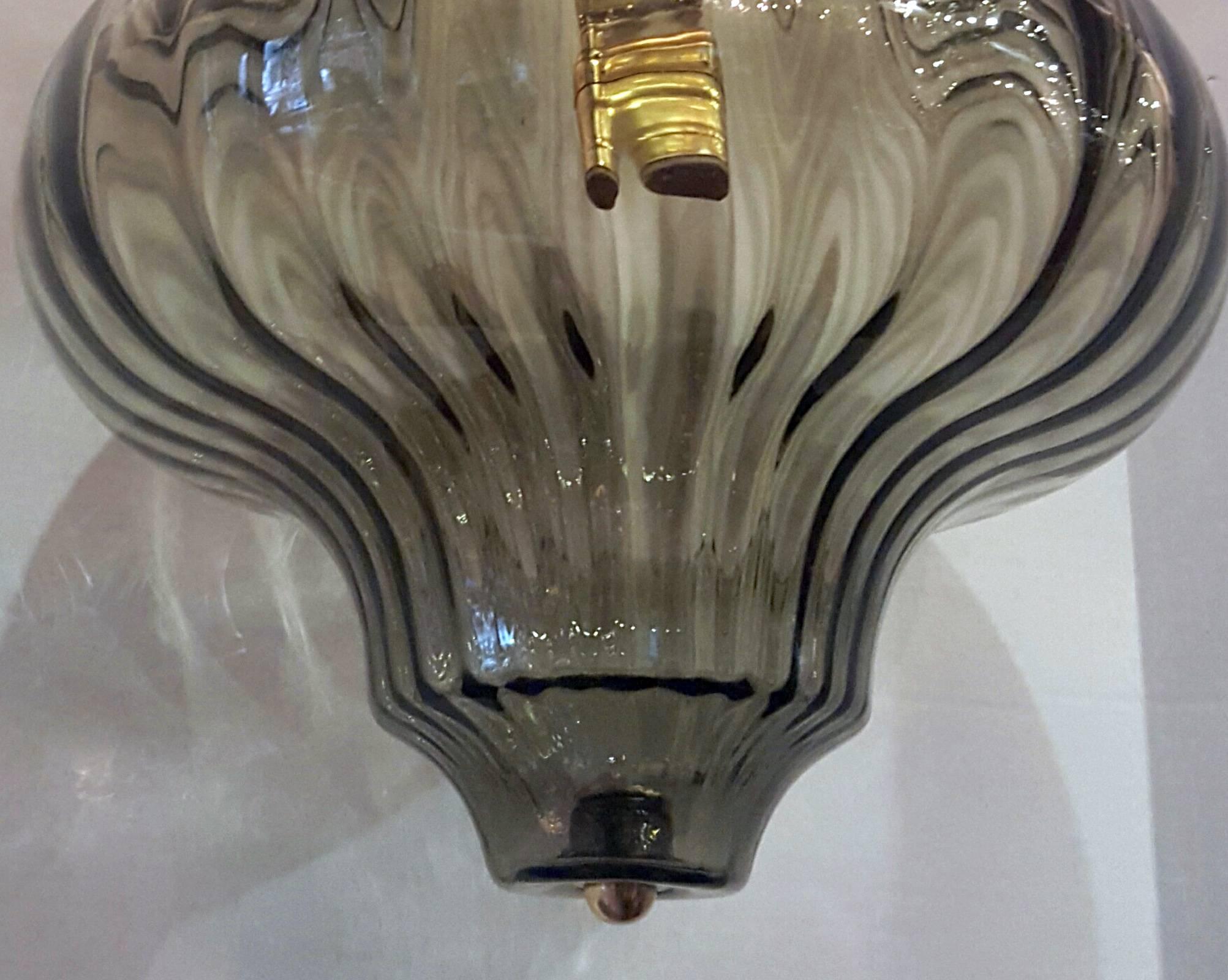 A circa 1960s Italian blown glass light fixture with interior light. 
Brass hardware.
 