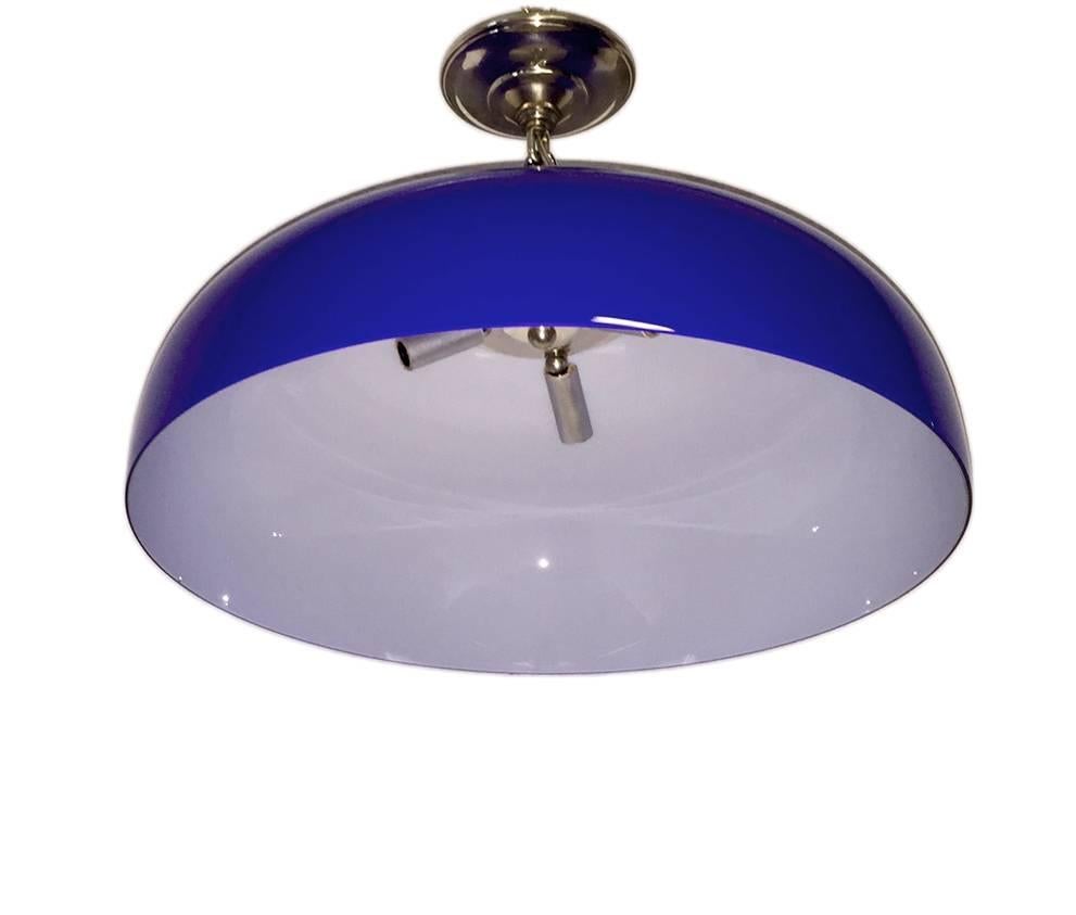 A Swedish blown cased blue glass pendant light fixture with three interior lights, circa 1960s.

Measurements:
Height/drop: 14″
Diameter: 19.5″