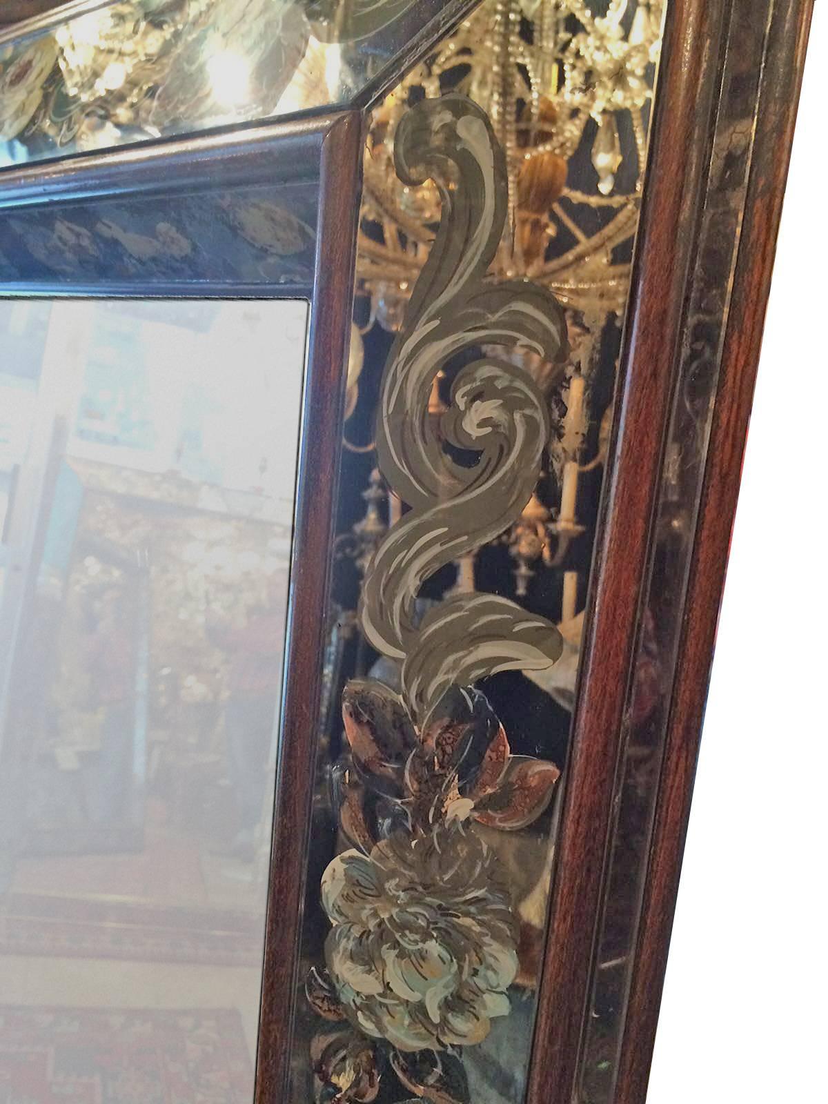 Italian reverse painted mirror with foliage and floral motif. Original patina, woodend edges, Italian, circa 1950s.

Measurements:
Height: 57".
Width: 47".