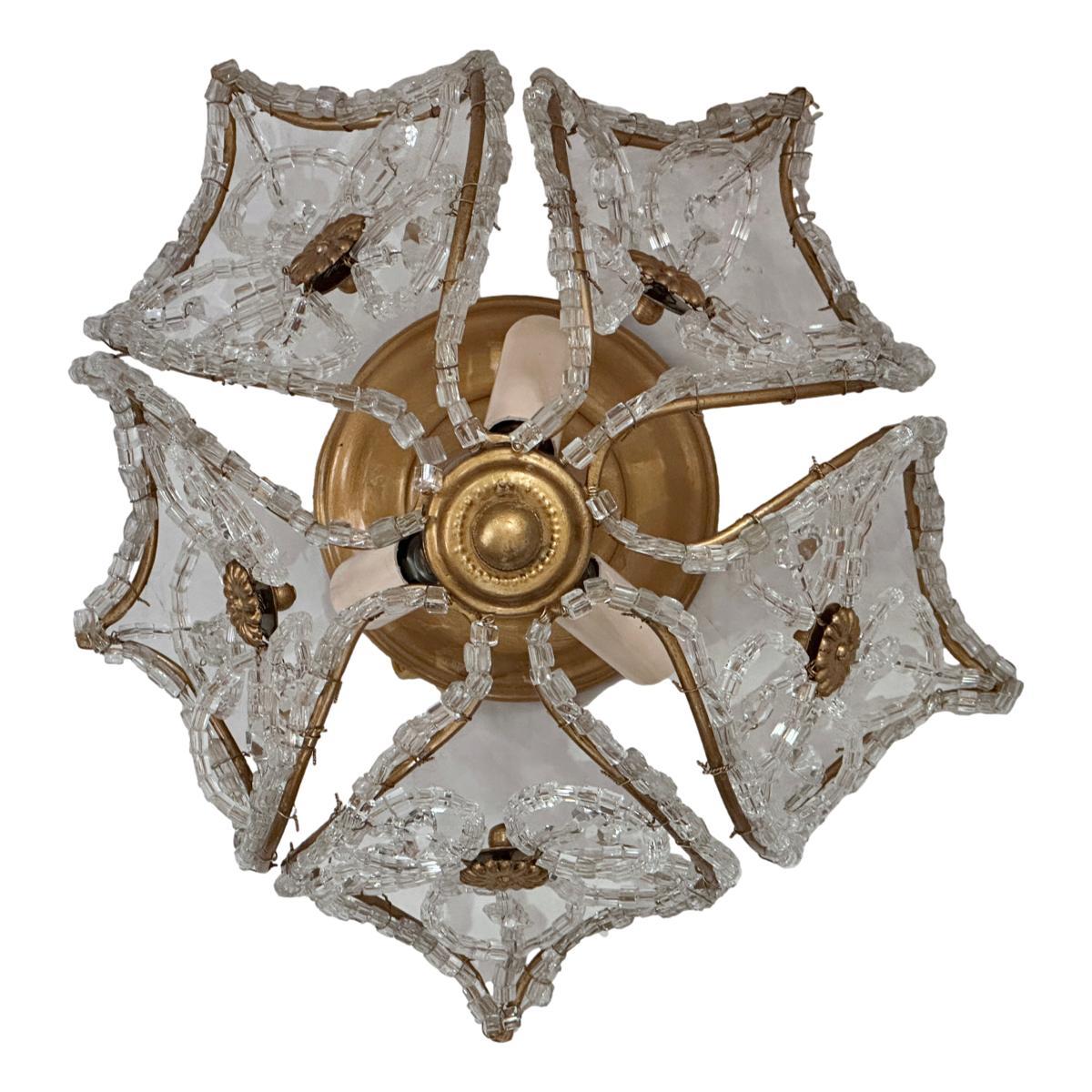 Set of 8 French, circa 1940's gilt metal and crystal light fixtures with 3 interior lights. Sold Individually.

Measurements:
Height (drop): 8.5