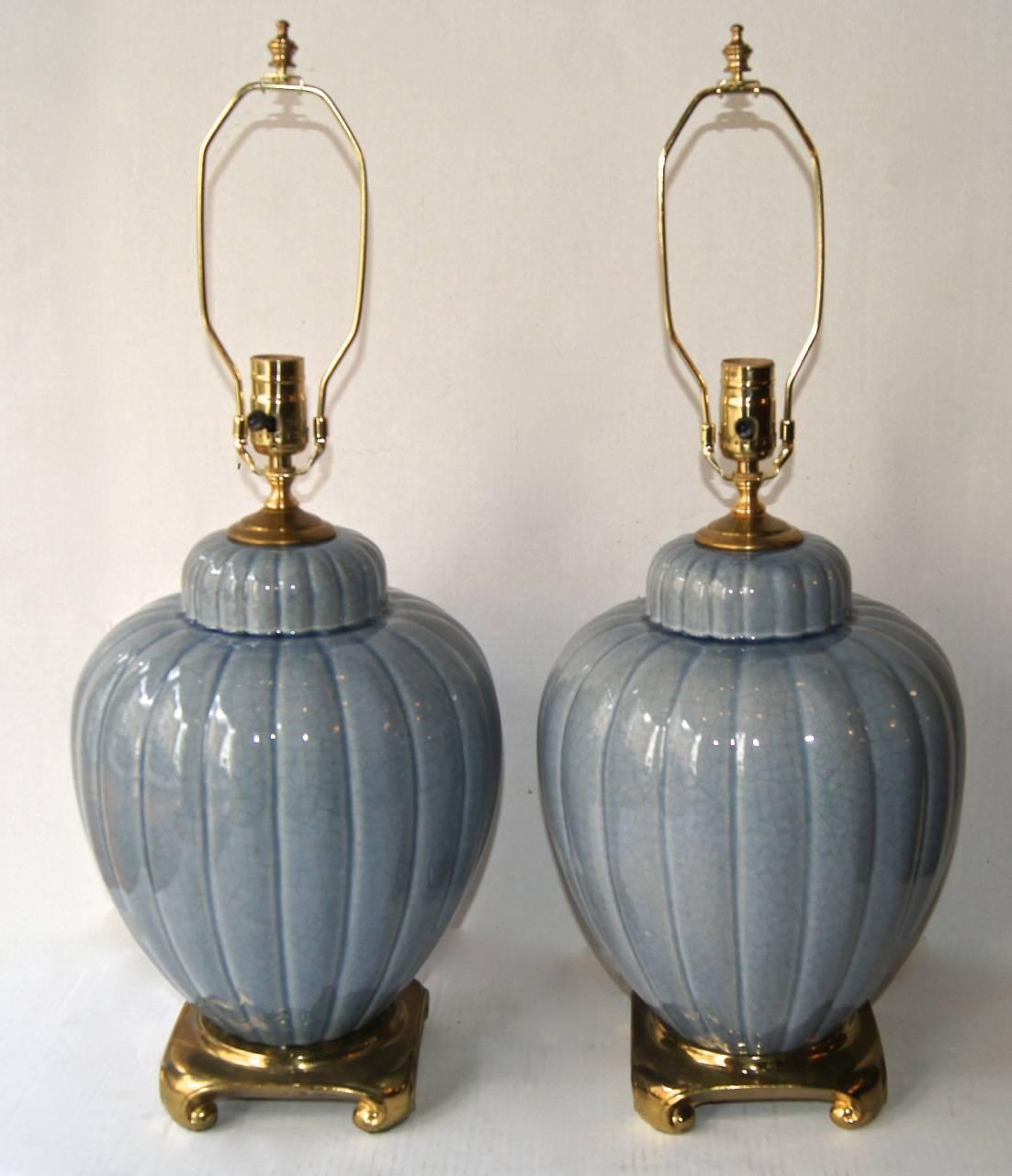 Pair of circa 1960s Italian glazed porcelain table lamps with gilt bases.

Measurements:
Height of body: 15