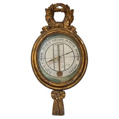 Barómetro antiguo de madera dorada de estilo neoclásico