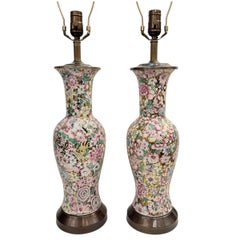 Coppia di lampade vintage con motivi floreali smaltati