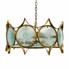 Une paire de luminaires « Moderne » en verre convexe et bronze. Vendu individuellement
