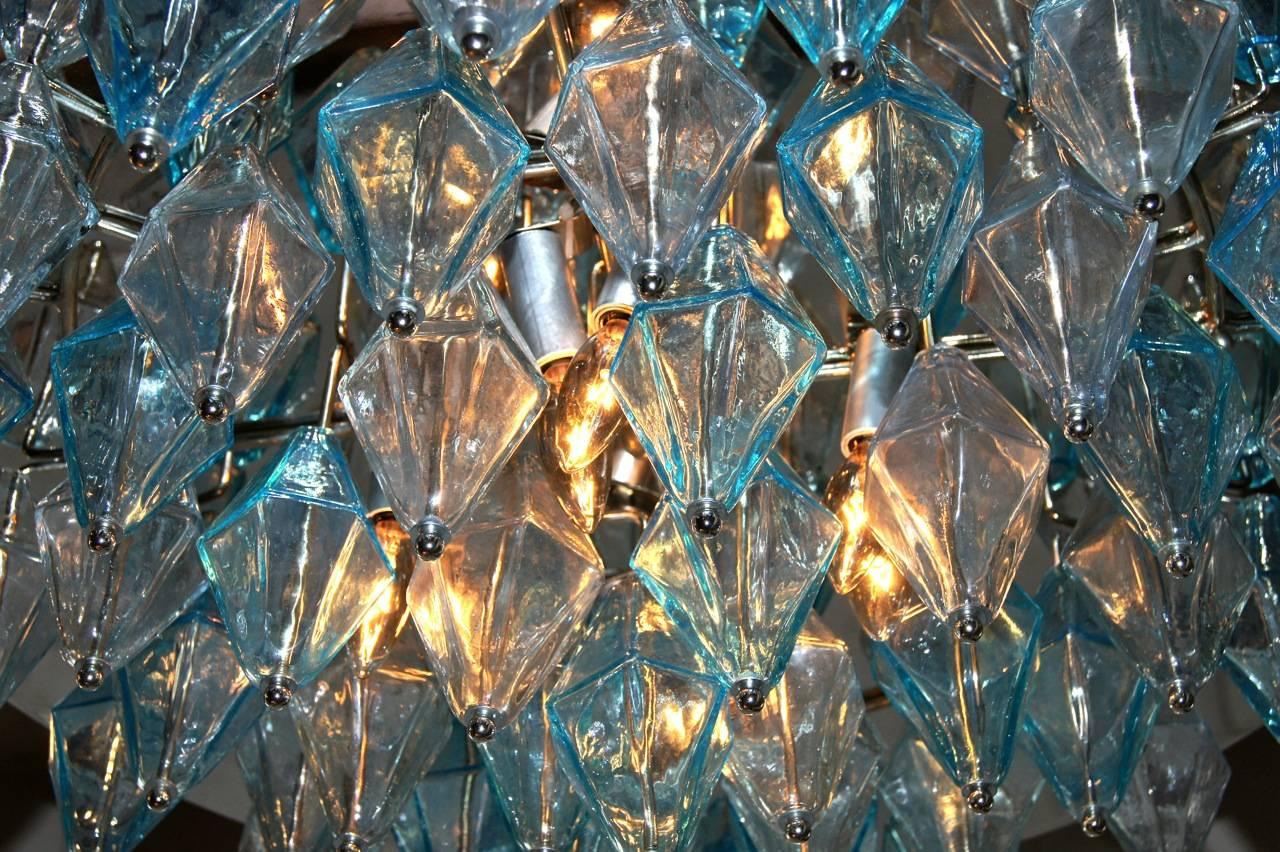 A pair of circa 1960s eight-light Italian ceiling-mounted nickel-plated fixtures with glass octahedron pendants in clear and blue. Sold individually.

Measurements:
Diameter 29?
Drop 10?.