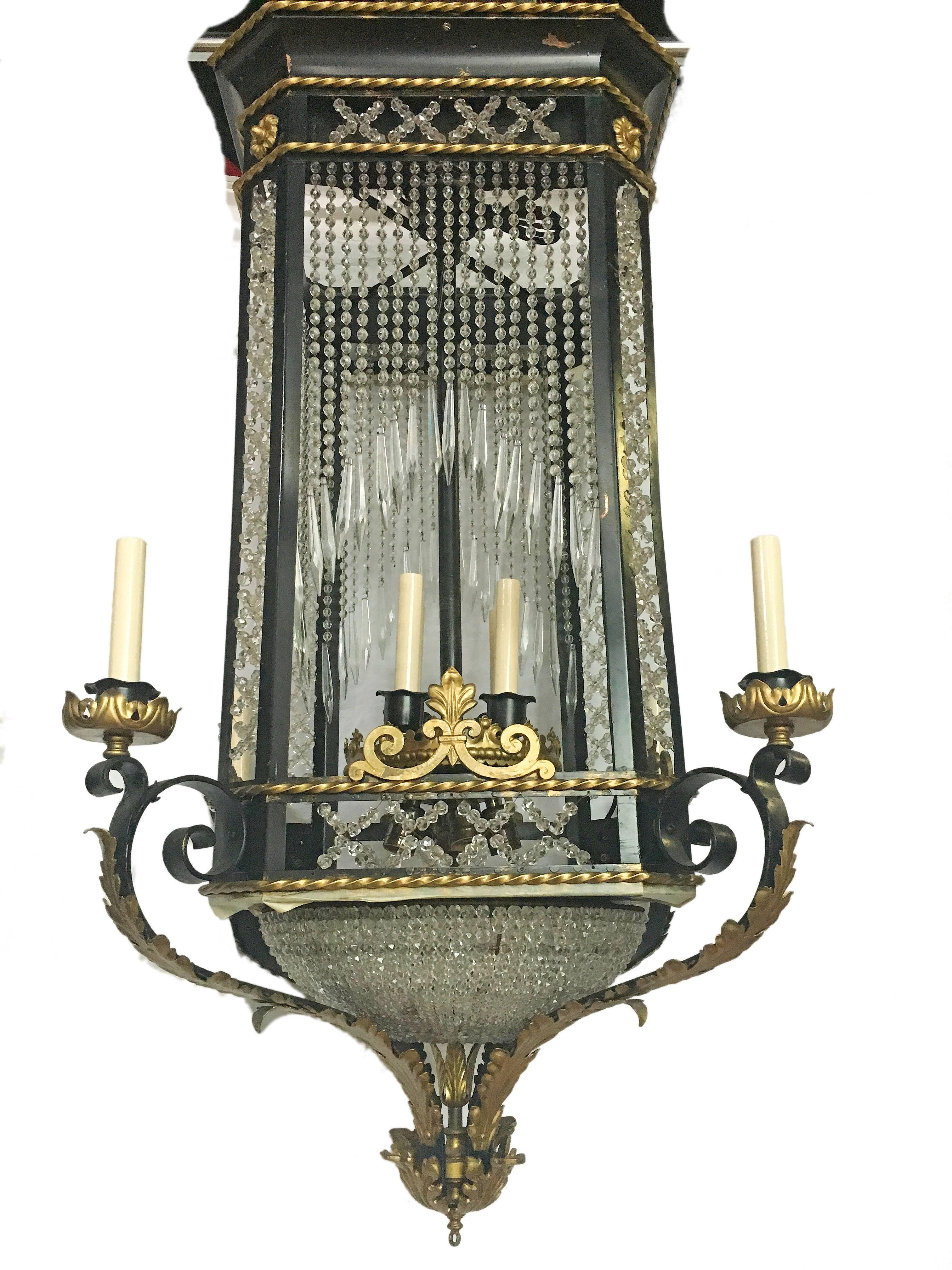 A lantern, pagoda shaped body with arms, gilt details and with crystal pendants eight lights, circa 1910.