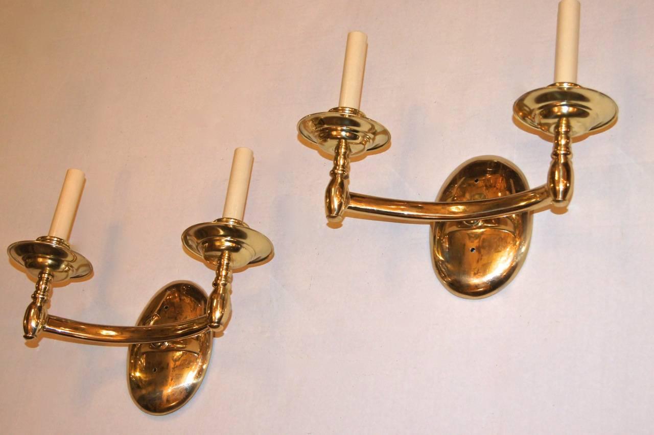 A set of six circa 1950's Italian polished bronze two-arm sconces with gold tone. Sold per pair.

Measurements:
Height: 10