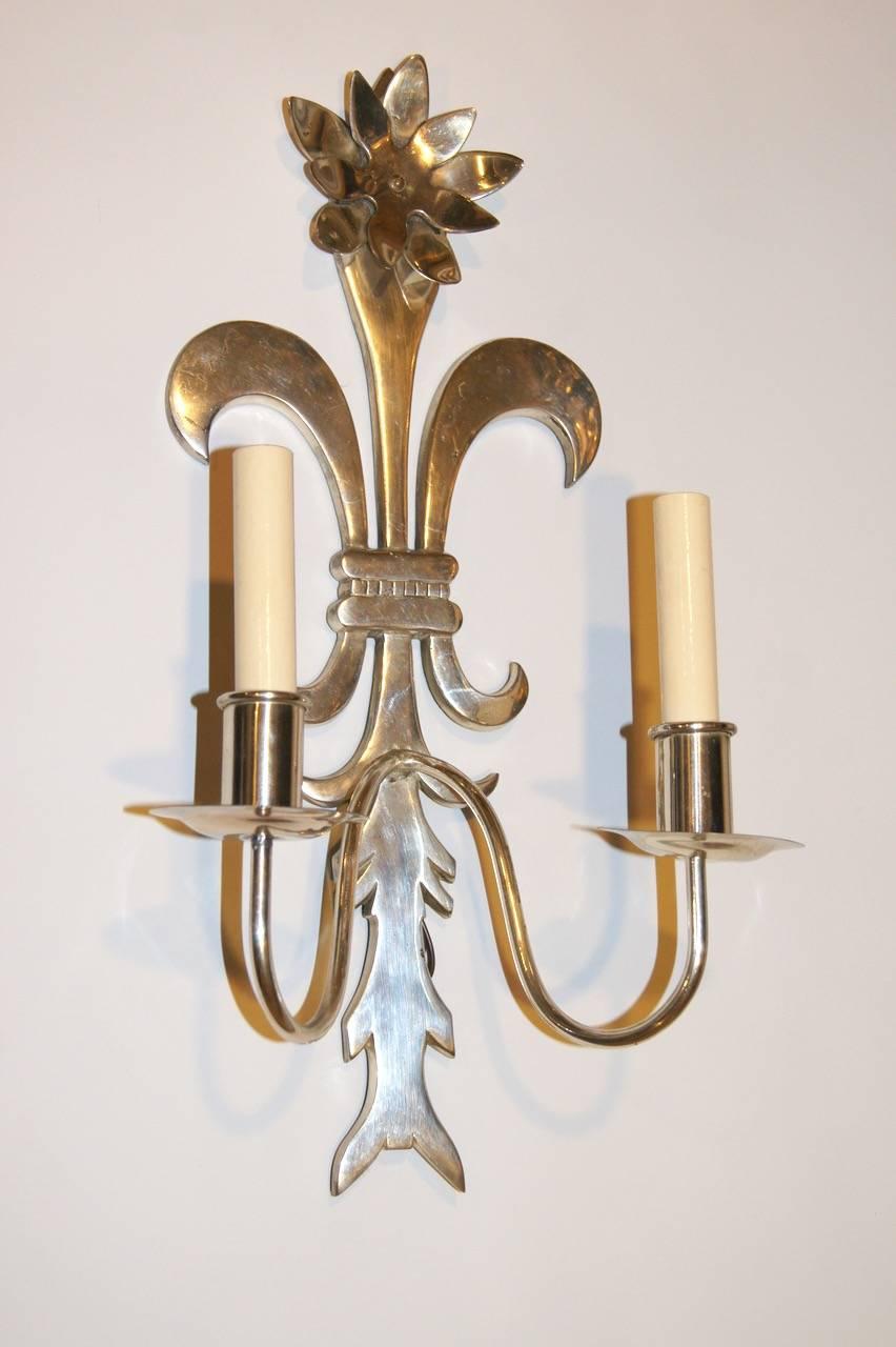 Set of 4 Italian, silver plated sconces with stylized foliage and floral motif. Double light.

Measurements:
Height: 20