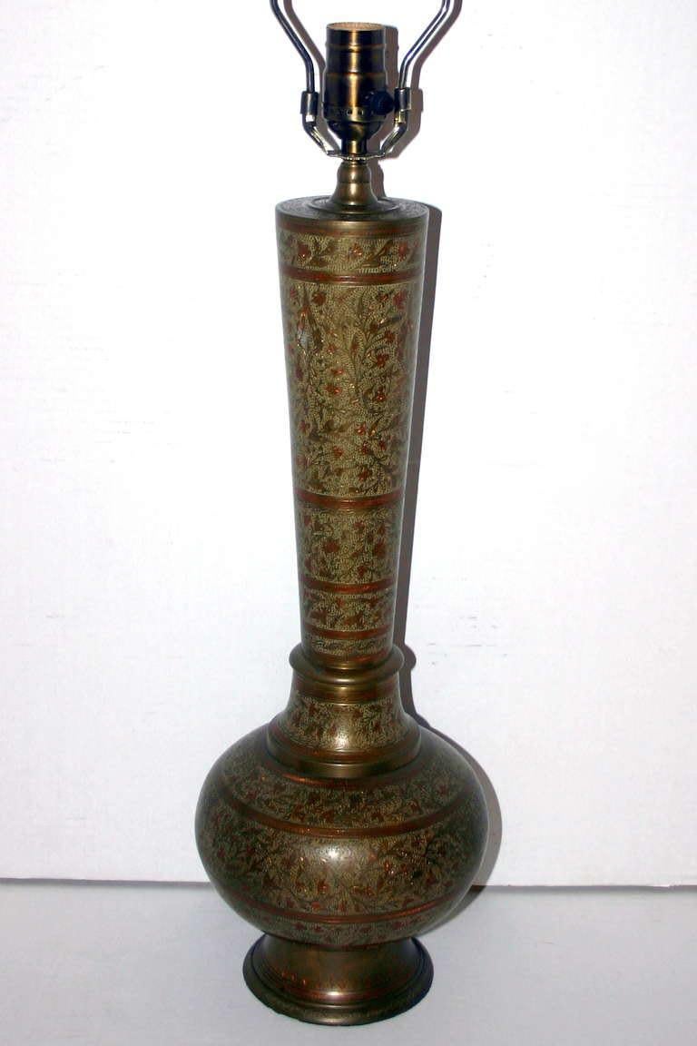 A single Turkish enameled and etched brass lamp with foliage and floral motif and original patina.

Measurements:
Height of body: 19.5