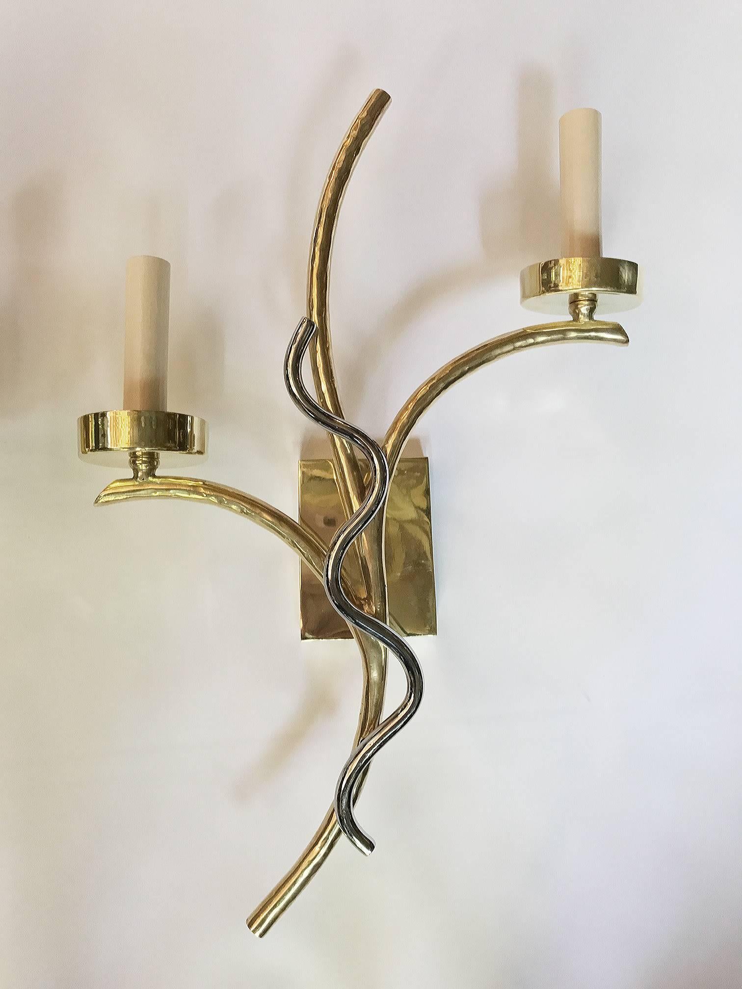 A pair of French, circa 1960s gilt and nickel-plated bronze two-arm sconces.

Measurements:
Height 18