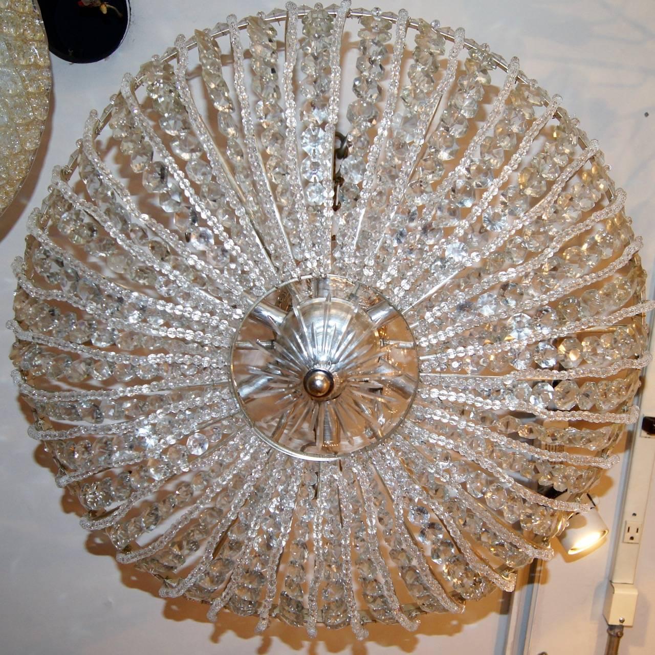 A pair of circa 1940s French beaded crystal flush semi flush mounted ceiling fixtures. Sold individually. Six interiors lights. Sold individually.

Measurements:
Drop 13