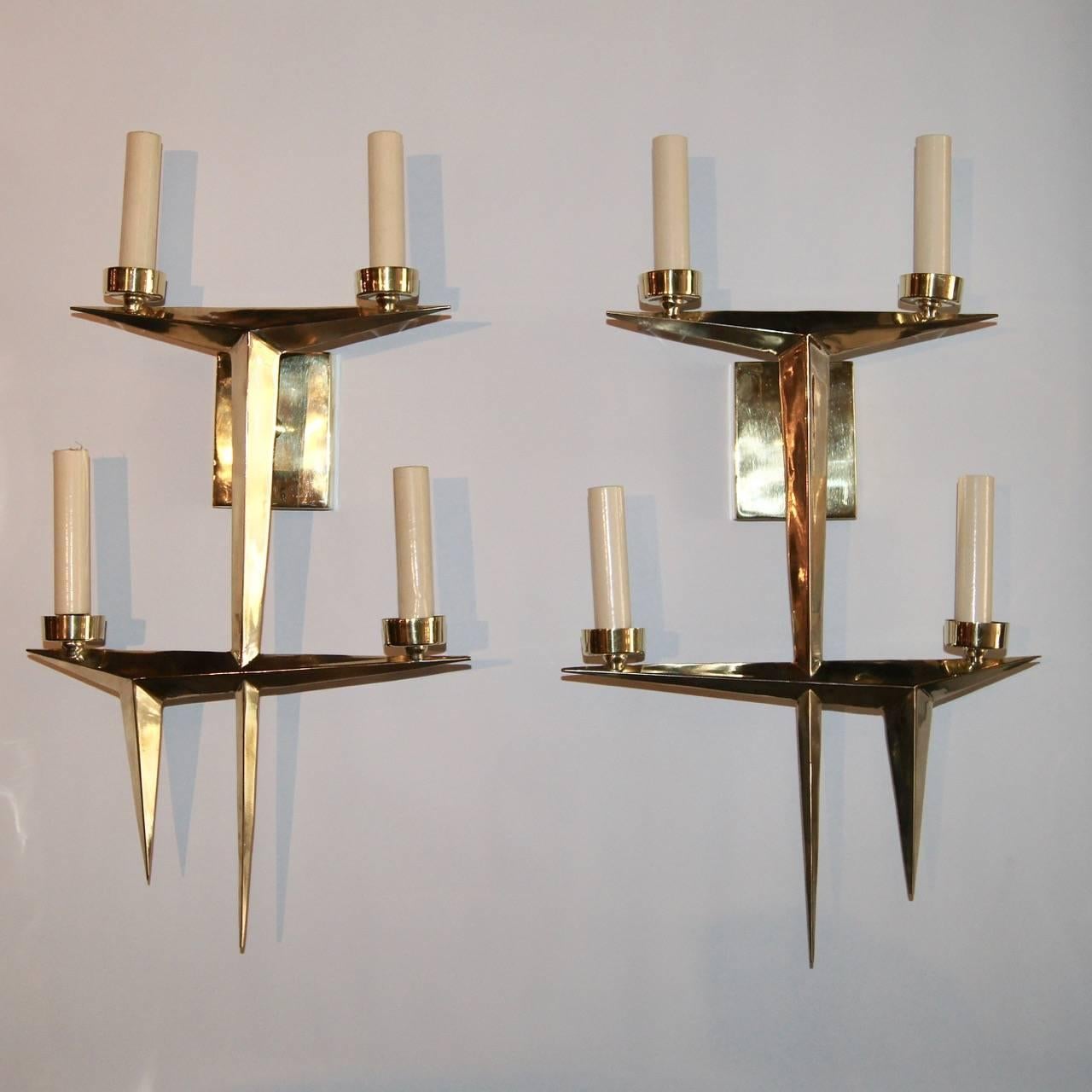 French moderne-style four-light sconces, polished bronze finish, circa 1950.

Measurements:
Height 21