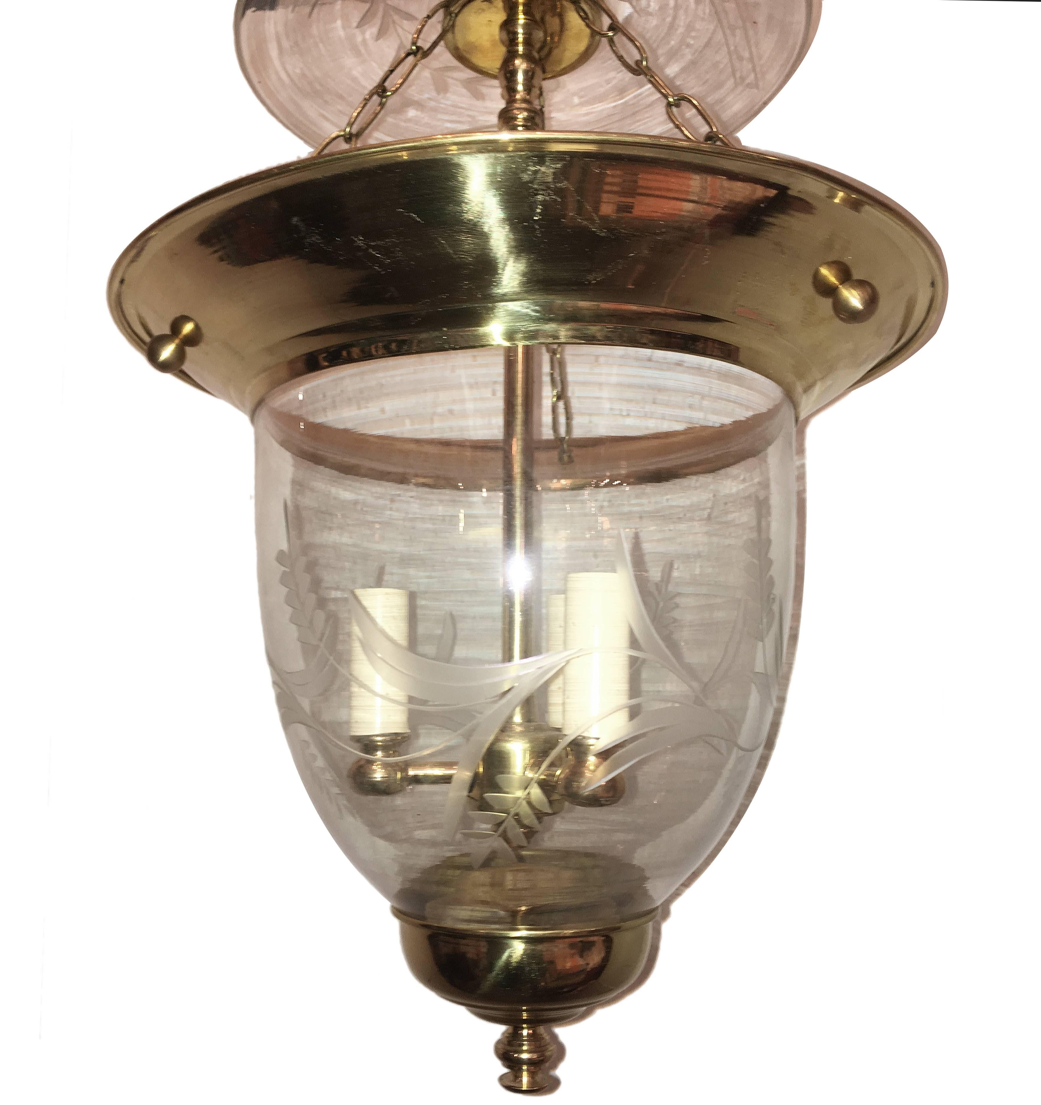 A set of twelve circa 1940's French etched glass lanterns with gilt bronze and three interior lights. Sold individually.

Measurements:
Diameter: 14