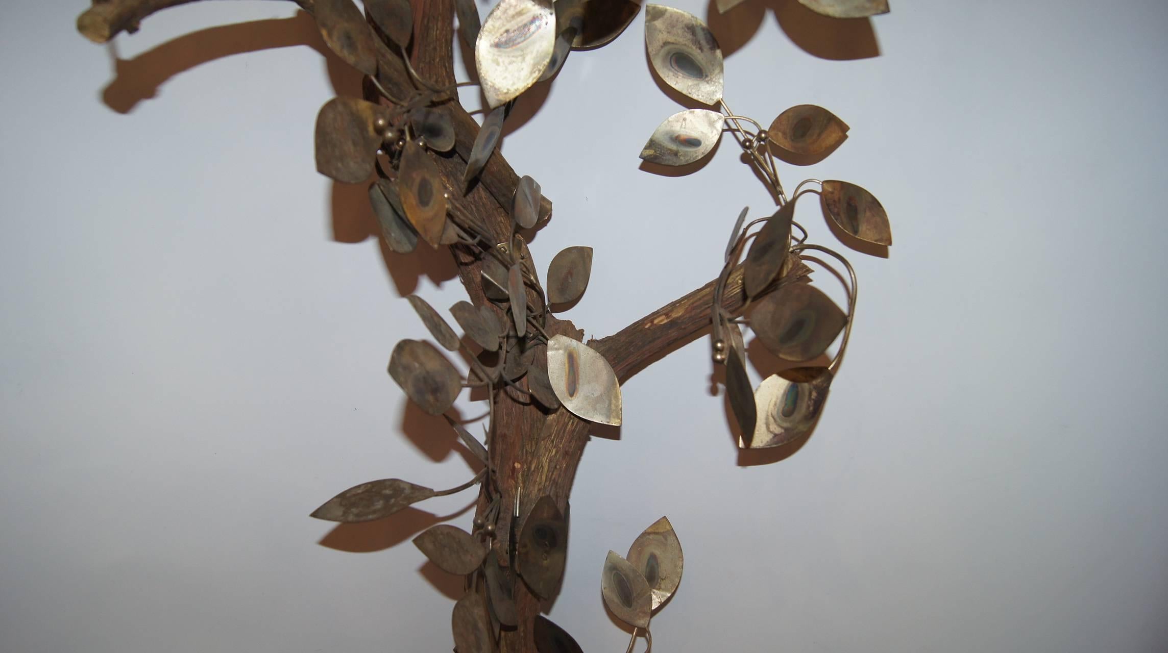 A circa 1960's Italian hammered and patinated metal tree.

Measurements:
Height: 74