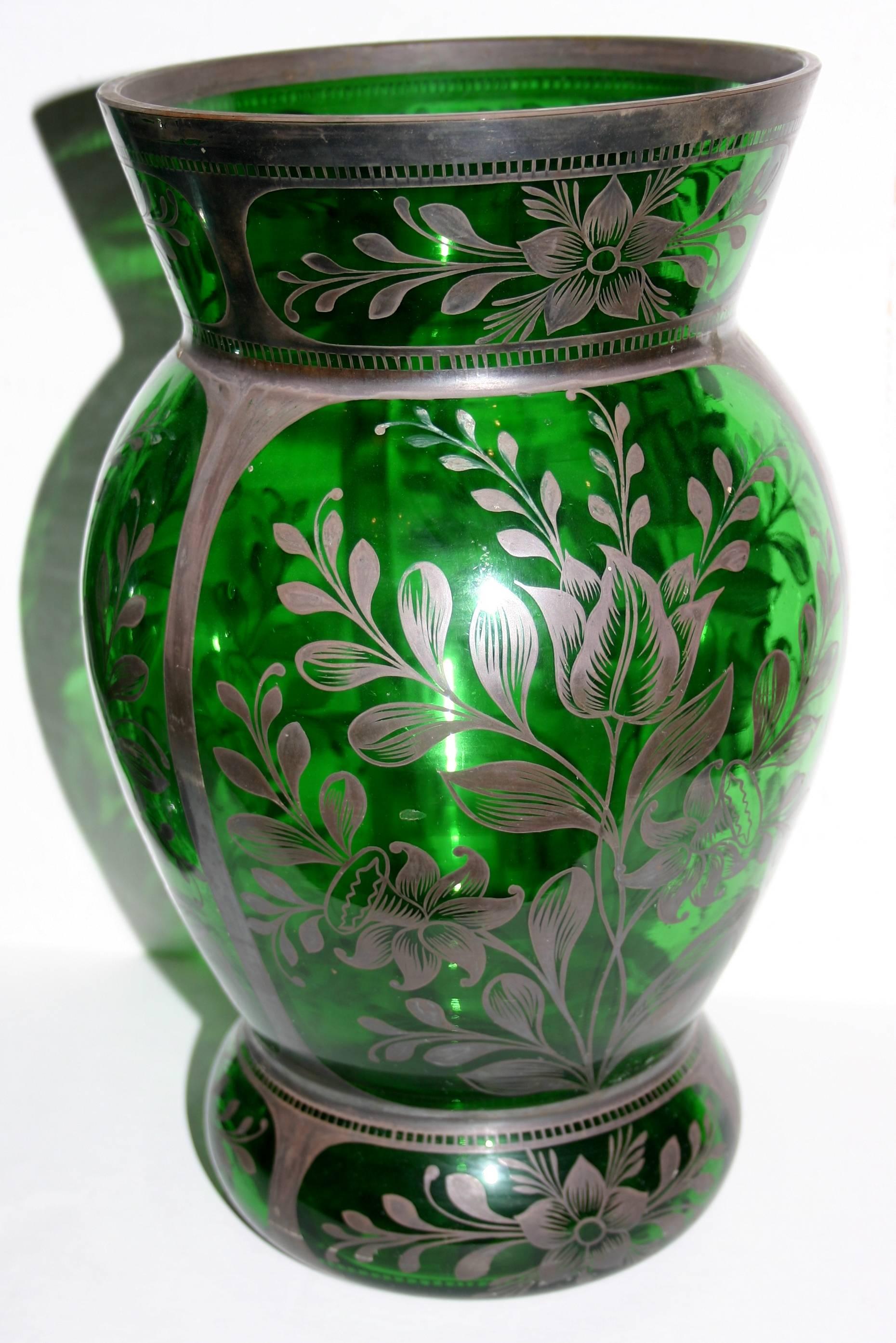 Pair of 1930s French emerald green glass vases with hand-applied silver decoration depicting foliage.

Measurements:
Height 13.25