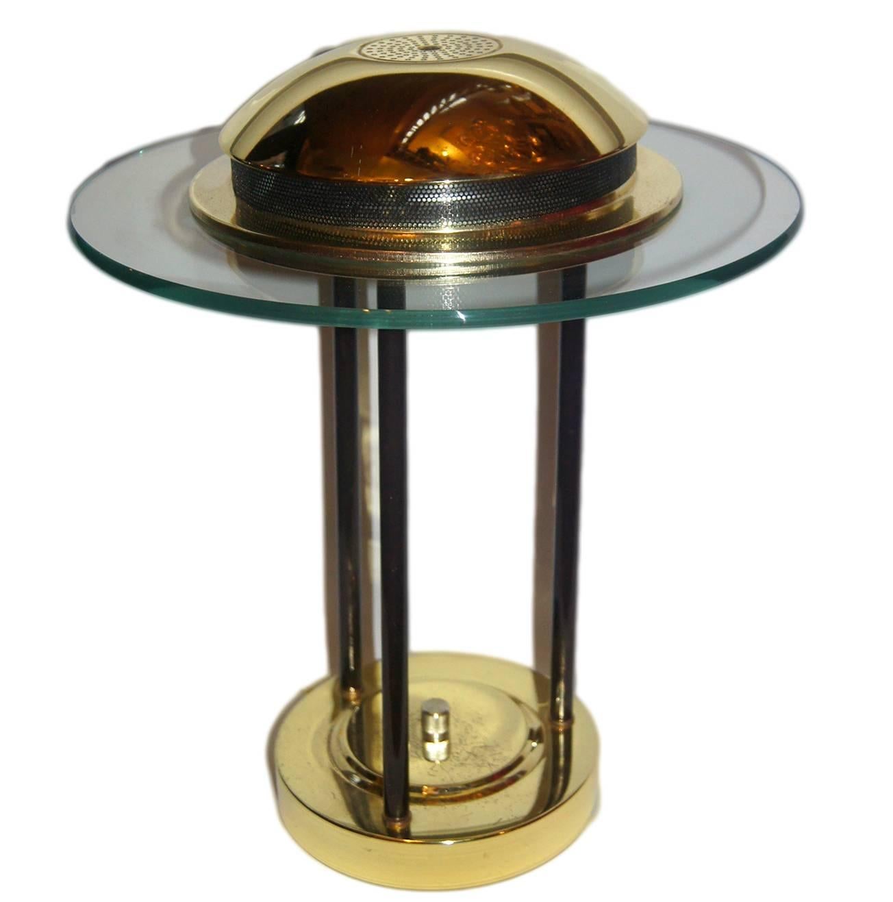 A vintage 1960s Italian brass and glass desk lamp.

Measurements:
Height 16