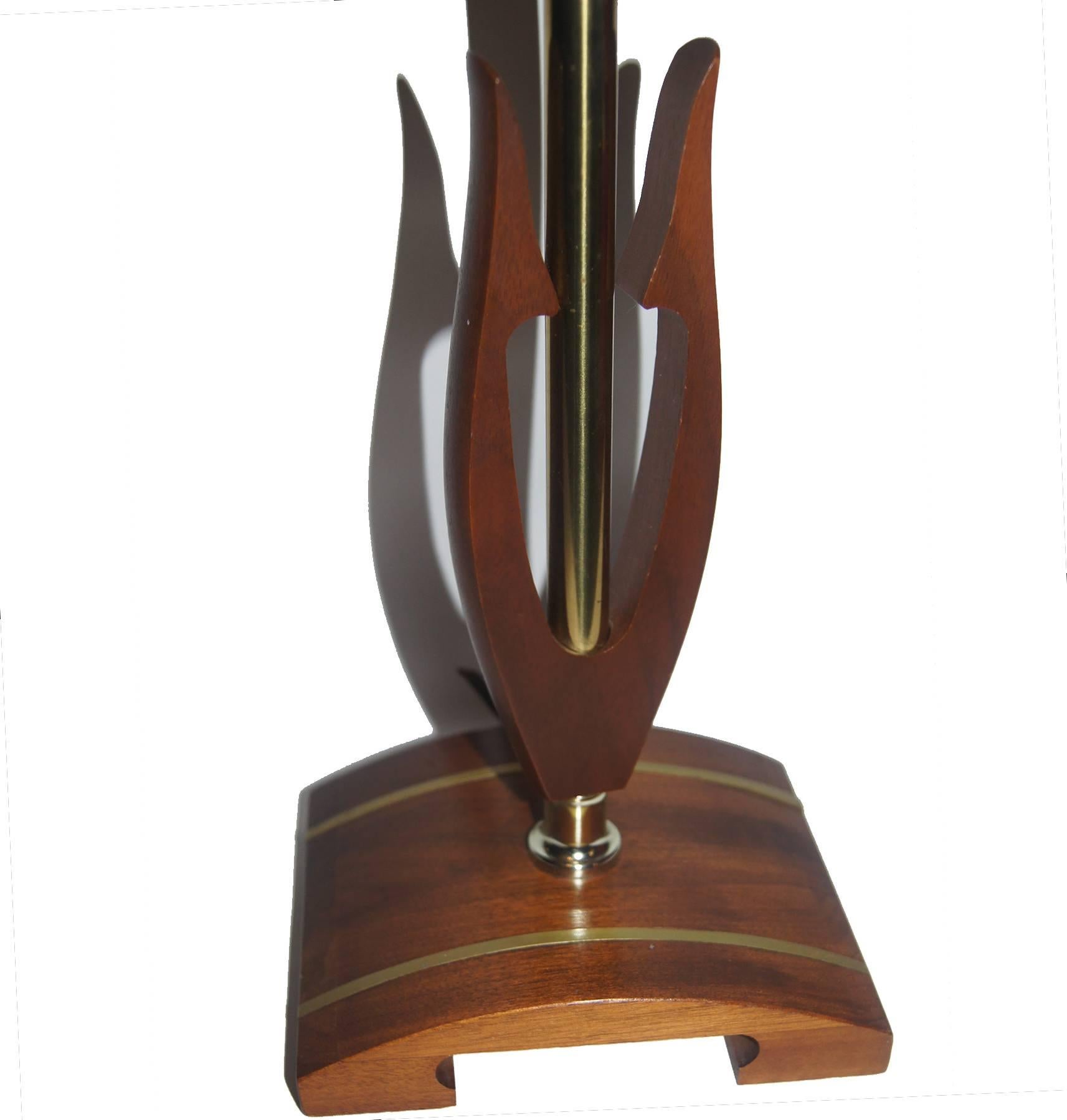 A midcentury Danish modern walnut desk lamp with stylized body and base with inset metal.

Measurements:
Height 19
