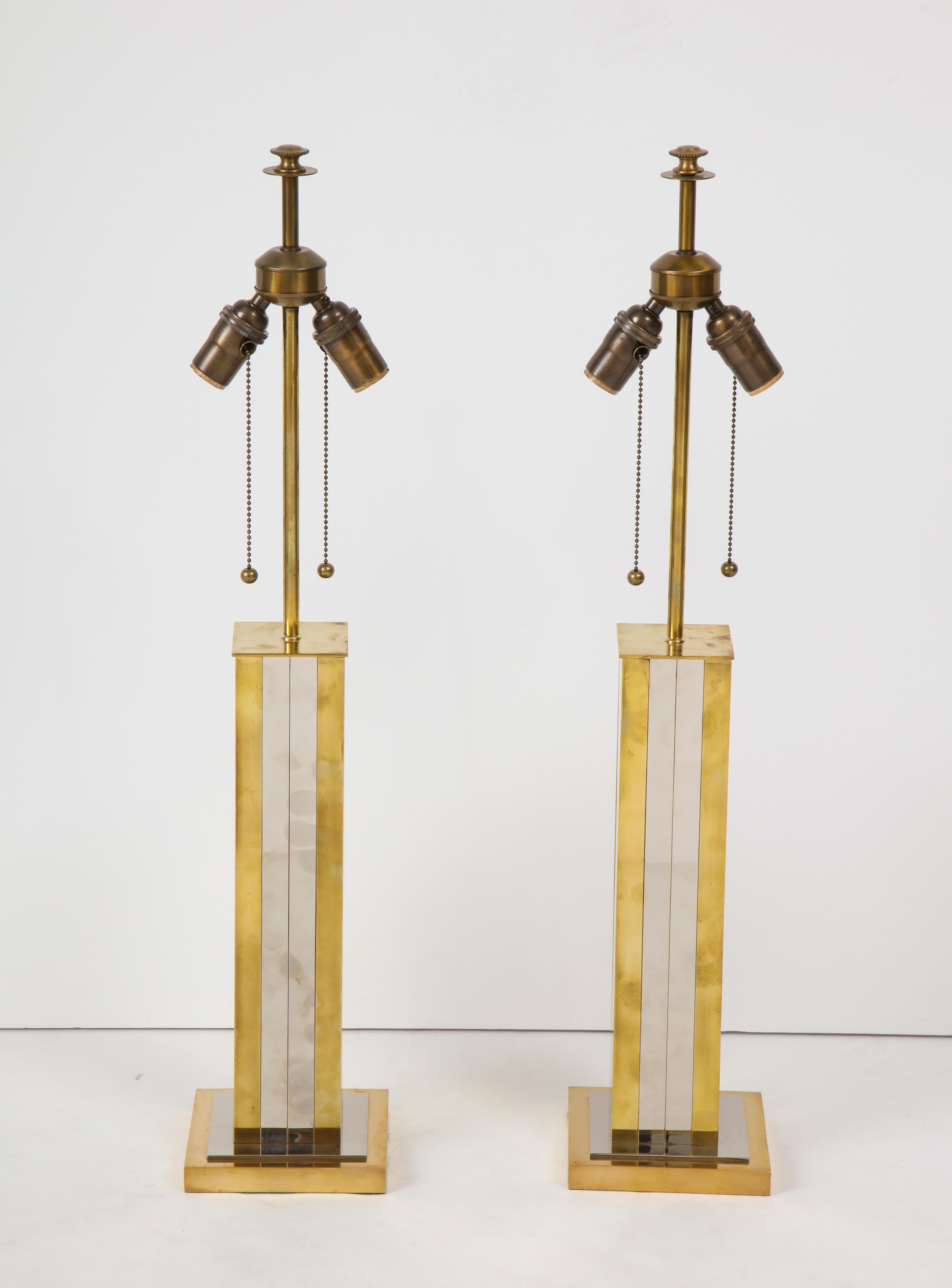 Pair of mid-20th century polished brass and chrome column lamps, square base.