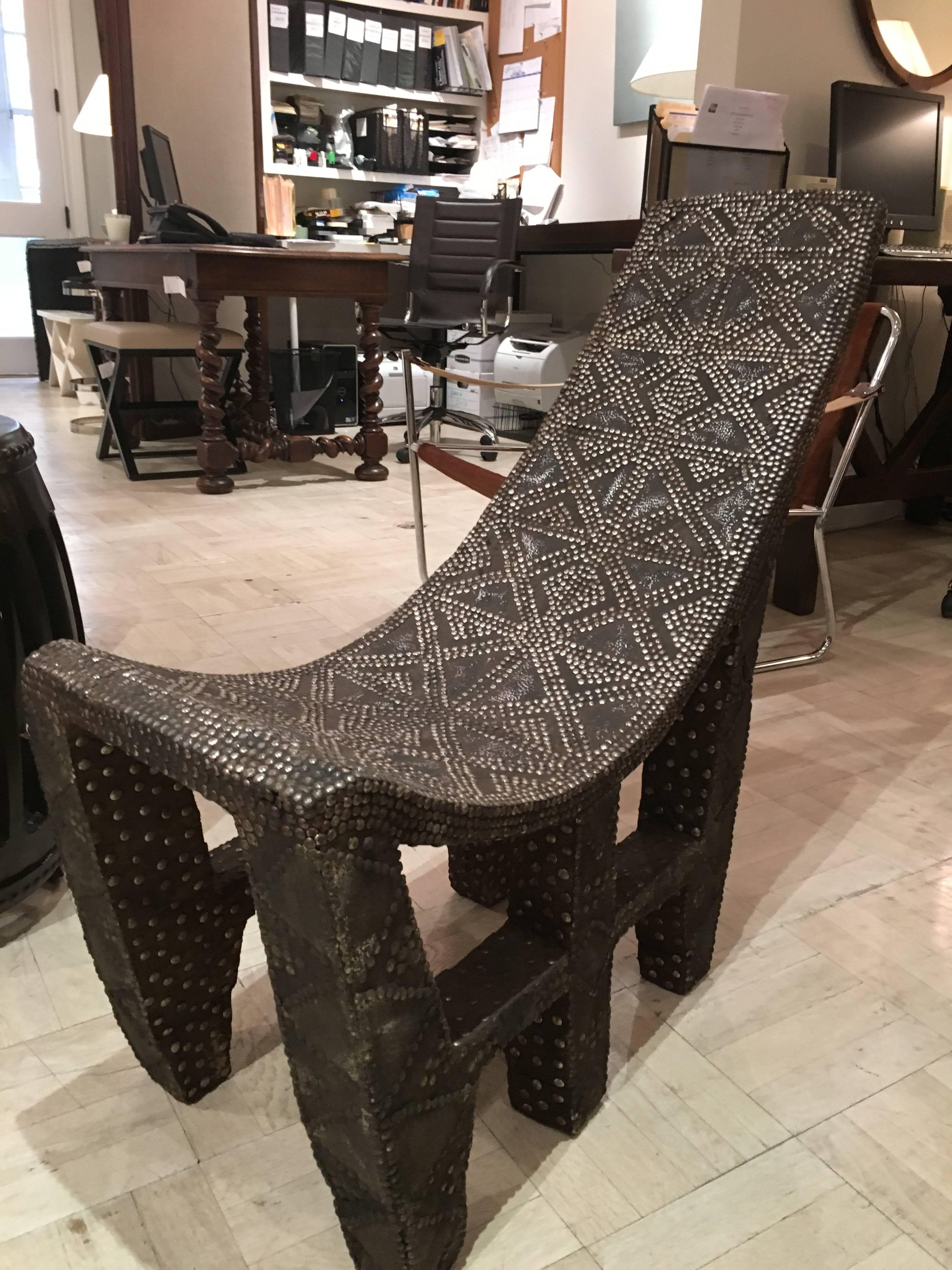 Late 19th century African studded chair zaire.