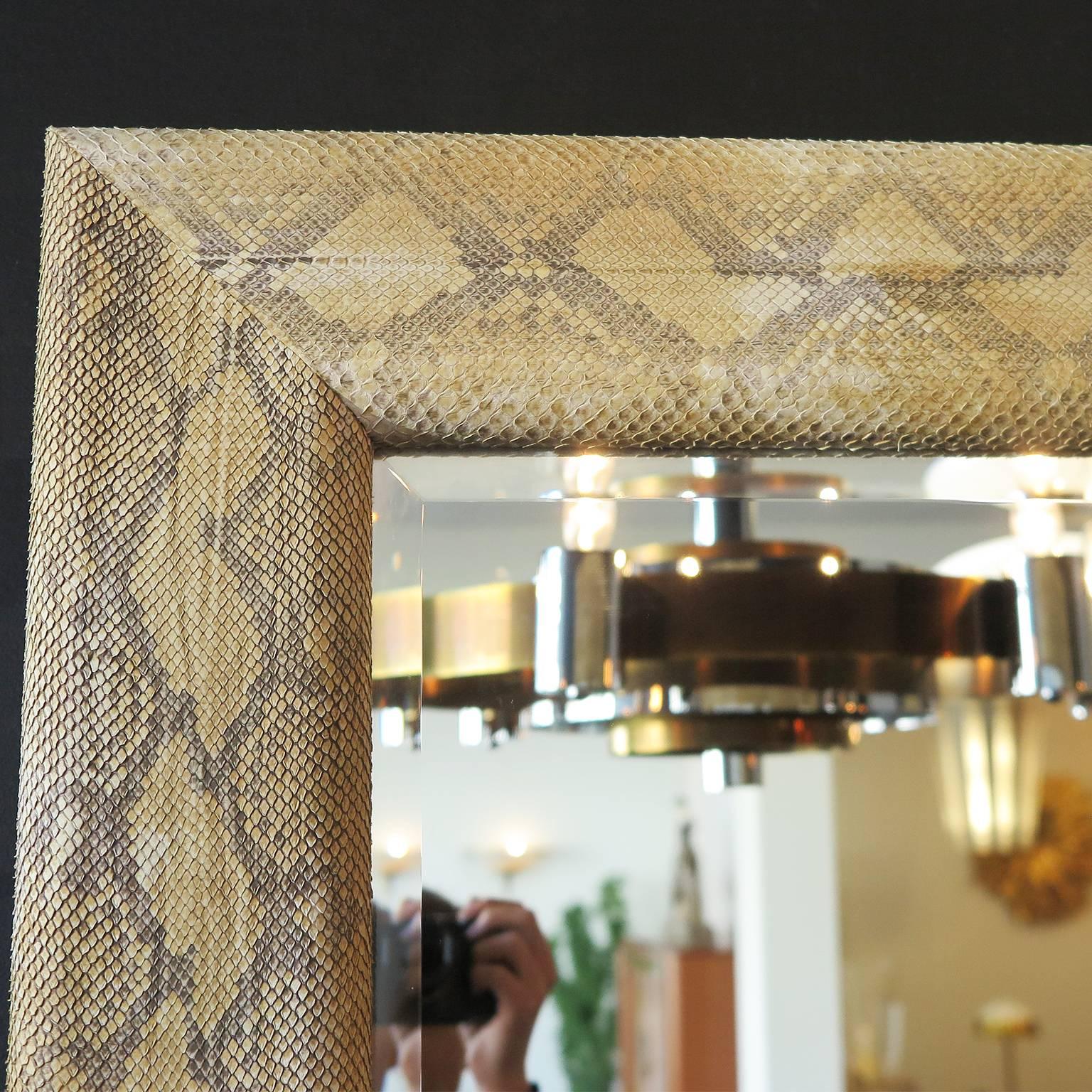 Square wooden mirror in anaconda skin with beveled mirror glass.