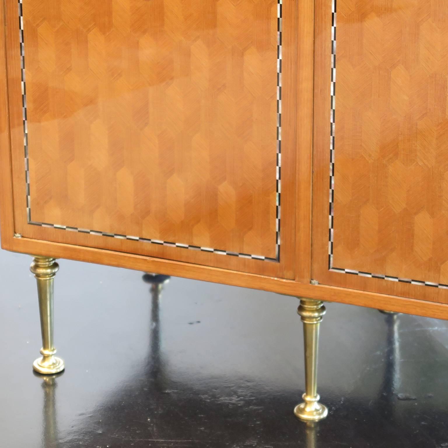 Sideboard signed by Jules Leleu. Stamped Leleu Paris and made in France. Numbered 31234. Geometric merquetry in blond mahogany veneer. Four frontal doors with double net of ebony and mother-of-pearl marquetry inlays. Rectangular frame with border