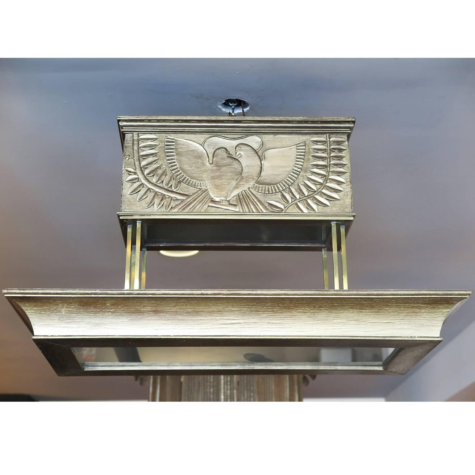Rectangular wooden chandelier with bas relief doves and palms with a white-gold finish. Frosted glass panes and thin brass rods. In the style of Petitot. Four candelabra bulbs inside.