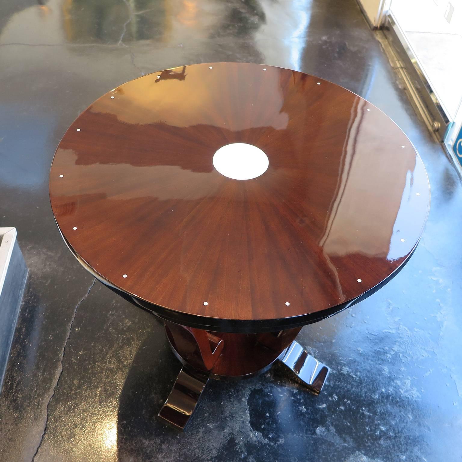 French Art Deco round side table circa 1930's with lacquered mahogany in starburst design.  Espresso lacquer detailing and round ivory lacquer inlay on top.  
