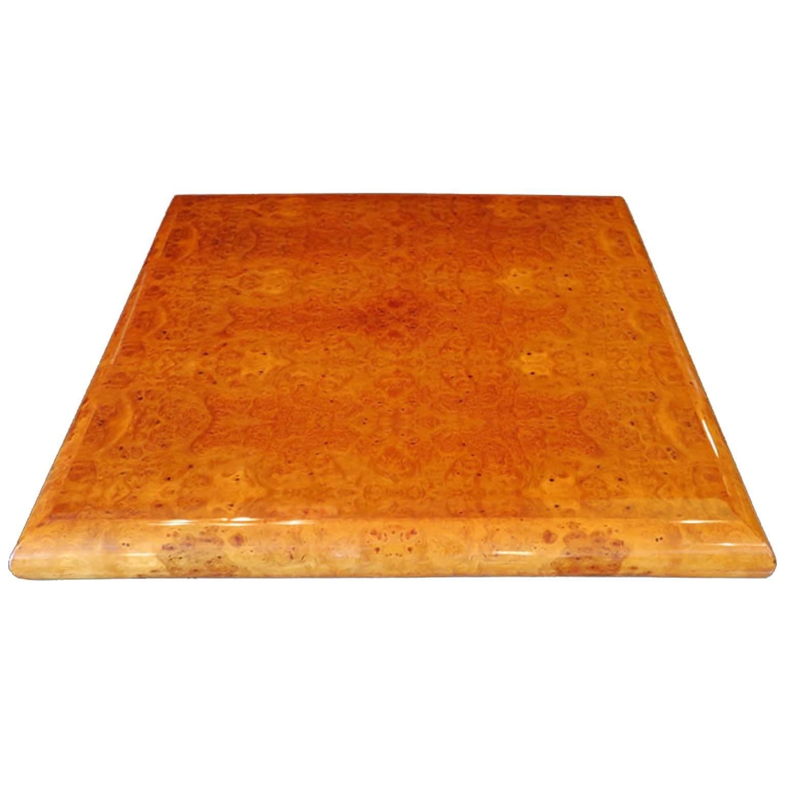 Large-scale square, Art Deco coffee table in rich lacquered elm burl. High-gloss and glamorous, features minimalist modern design with rounded corners, 1940s, France.

