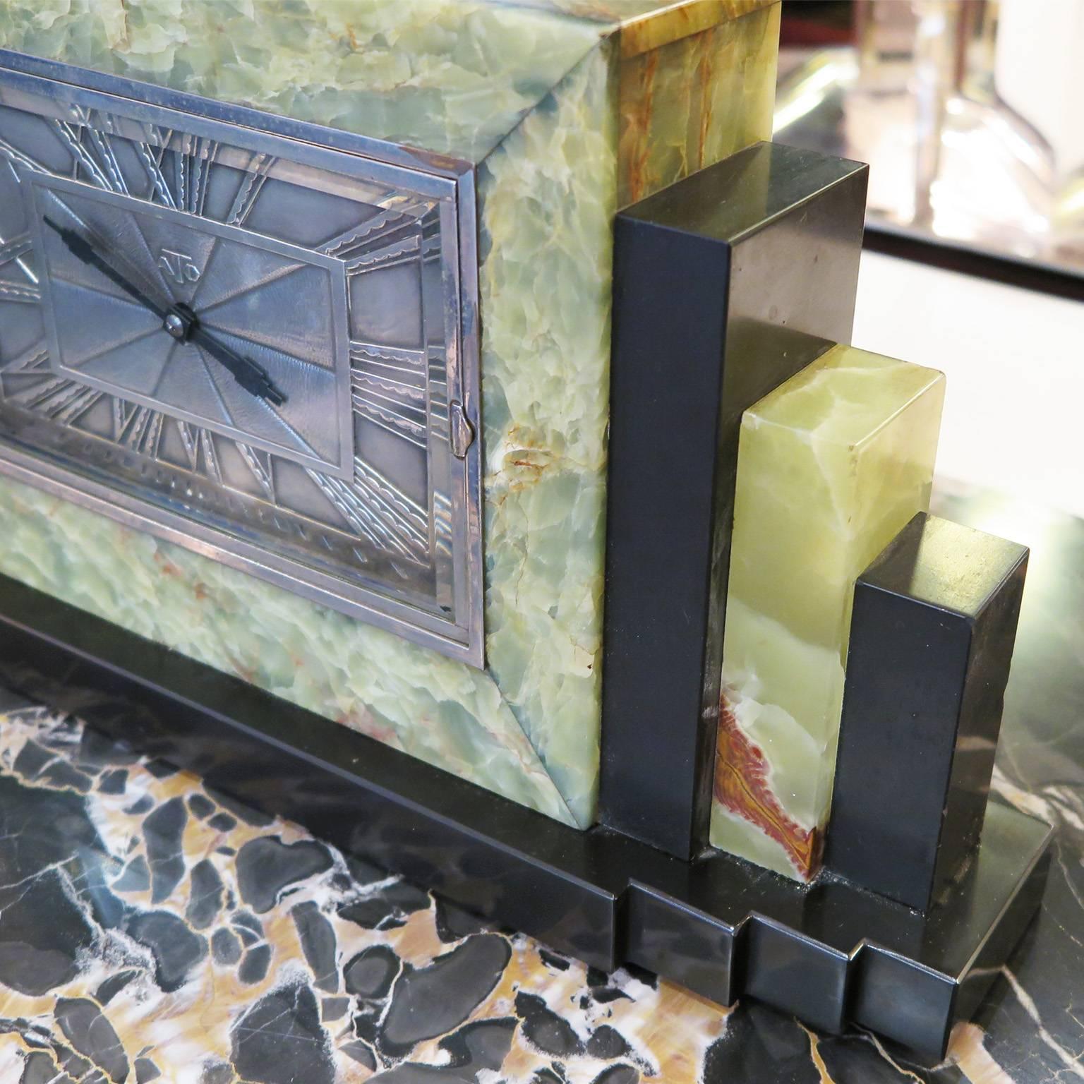 ATO clock by Leon Hatot (1883-1953.) Features stunning green onyx with black marble columns and base. Radiant dial with Arabic numerals in silver. From France, circa 1925-1930.