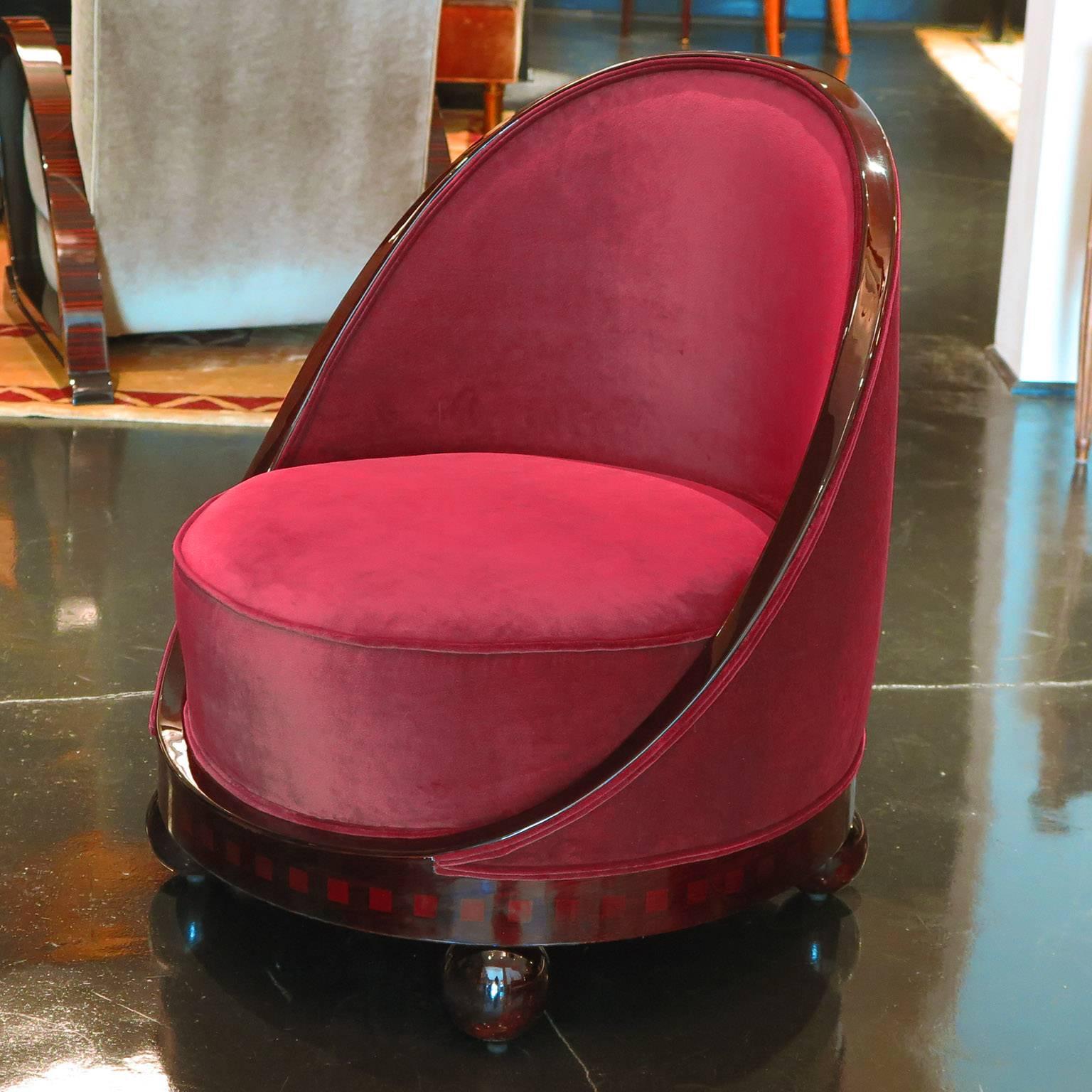 Unusual pair of oval boudoir slipper chairs in rosewood with parquetry squares along base. Four black ball feet. Re-upholstered in Magenta silk velvet.