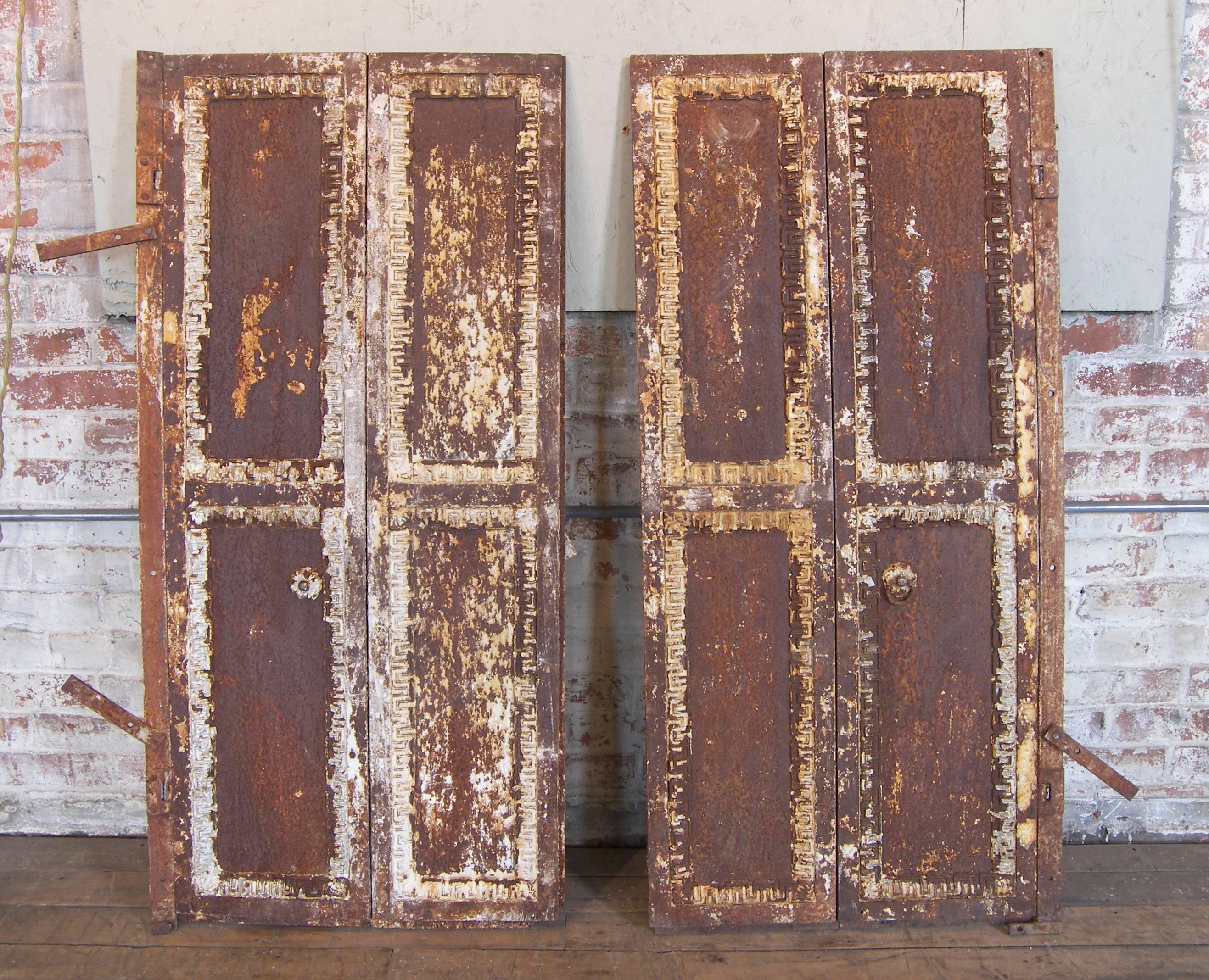Pair of Vintage Industrial Antique Window Shutters / Doors Made of Cast Iron. Beautiful Rusted Patina with Neoclassical Greek Key.