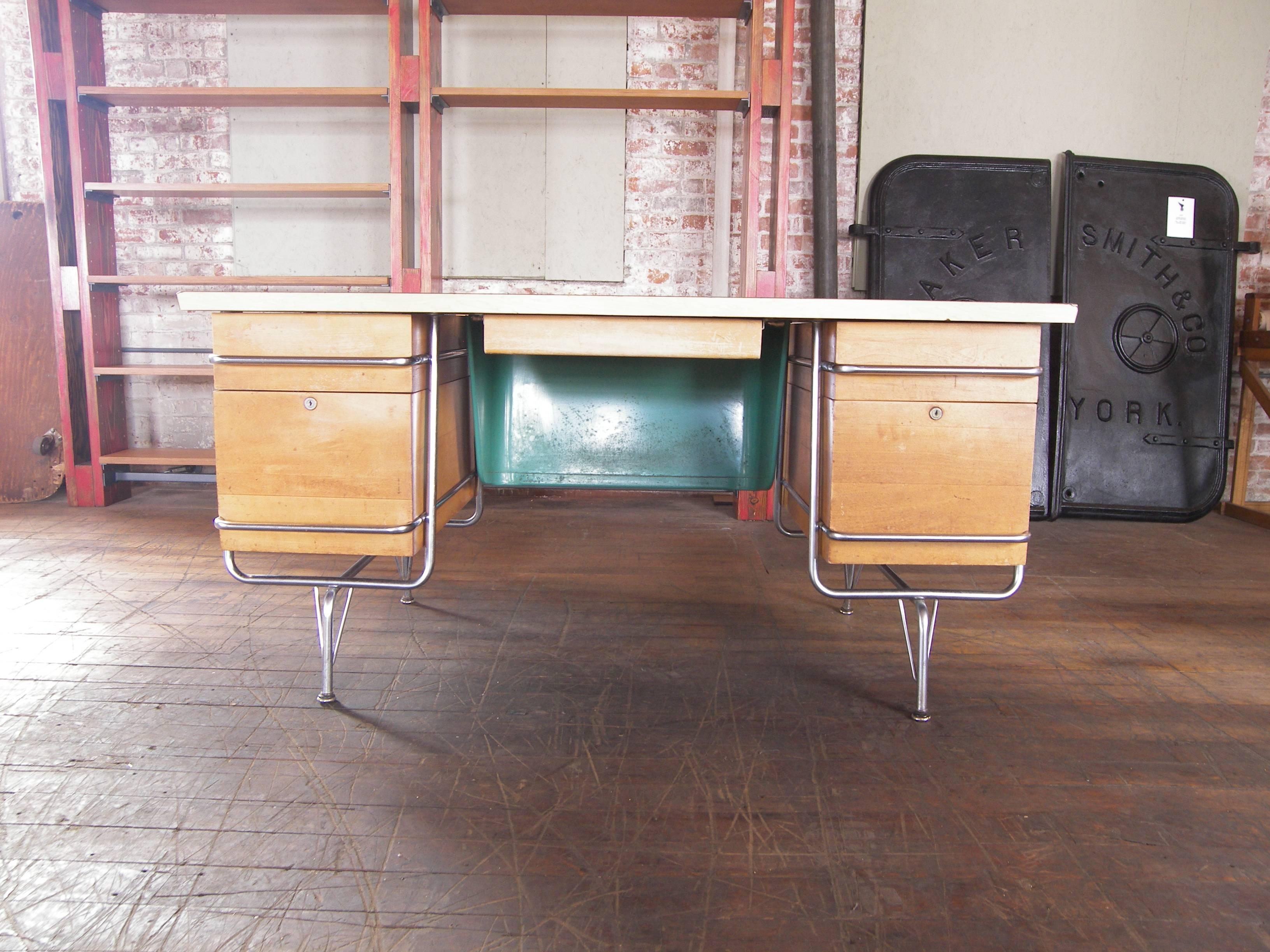 Authentic 1950s Mid-Century Modern Heywood-Wakefield Trimline model chrome and wood desk designed by KEM Weber. Overall dimensions measure 59 3/4