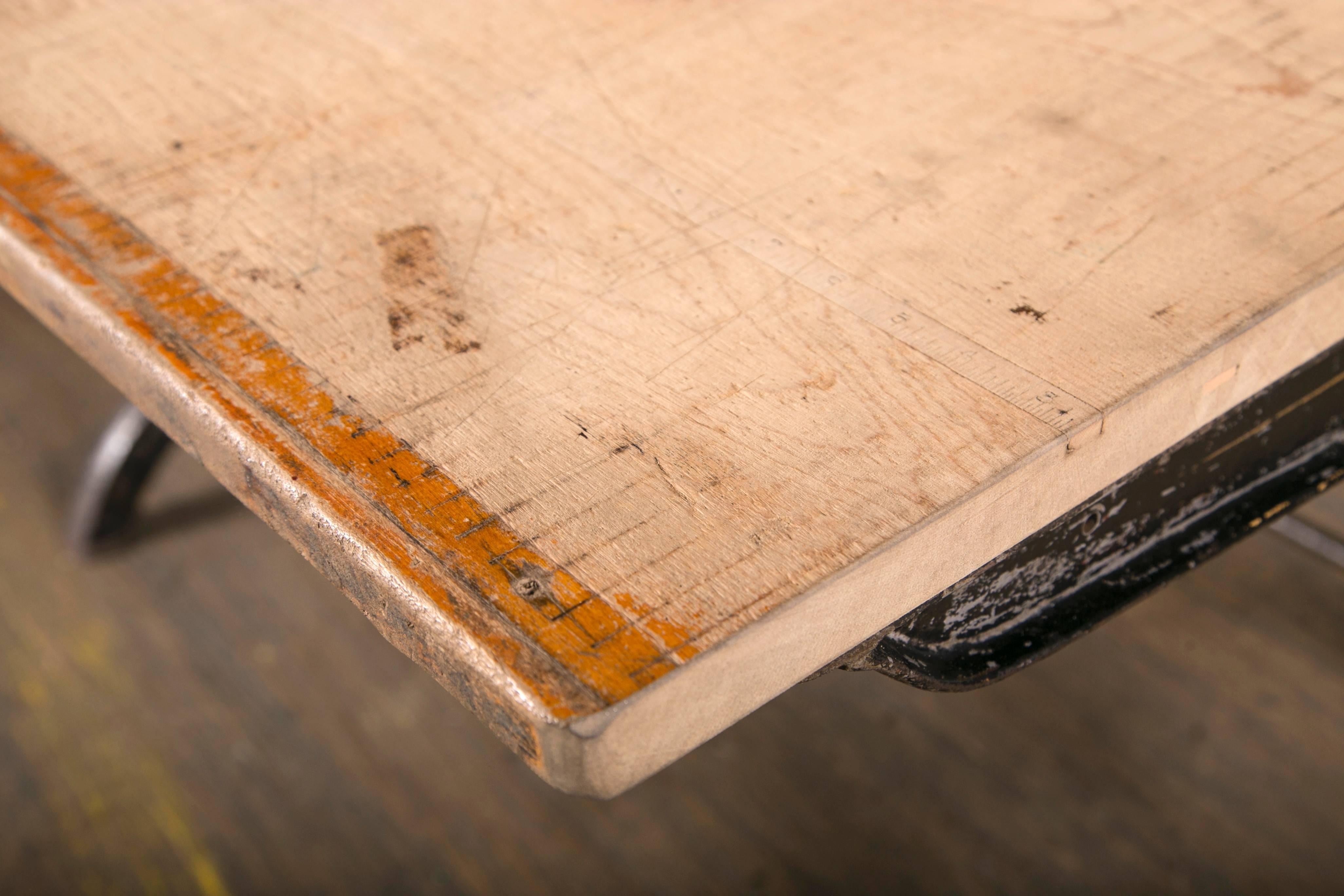 Vintage industrial desk made from antique paper cutting machine.