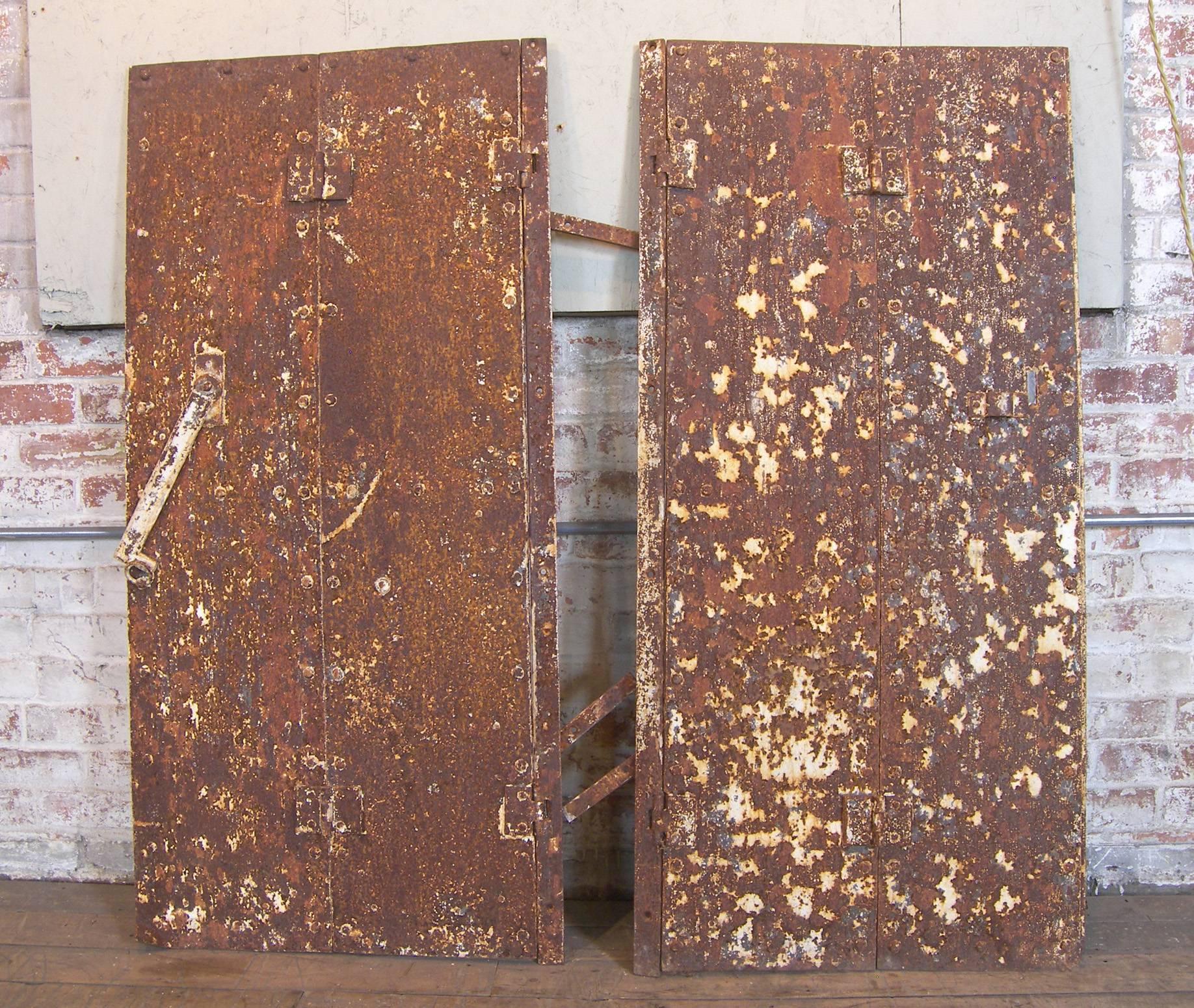 Pair of Antique Industrial Neoclassical Greek Key Cast Iron Doors Window Shutter In Distressed Condition In Oakville, CT