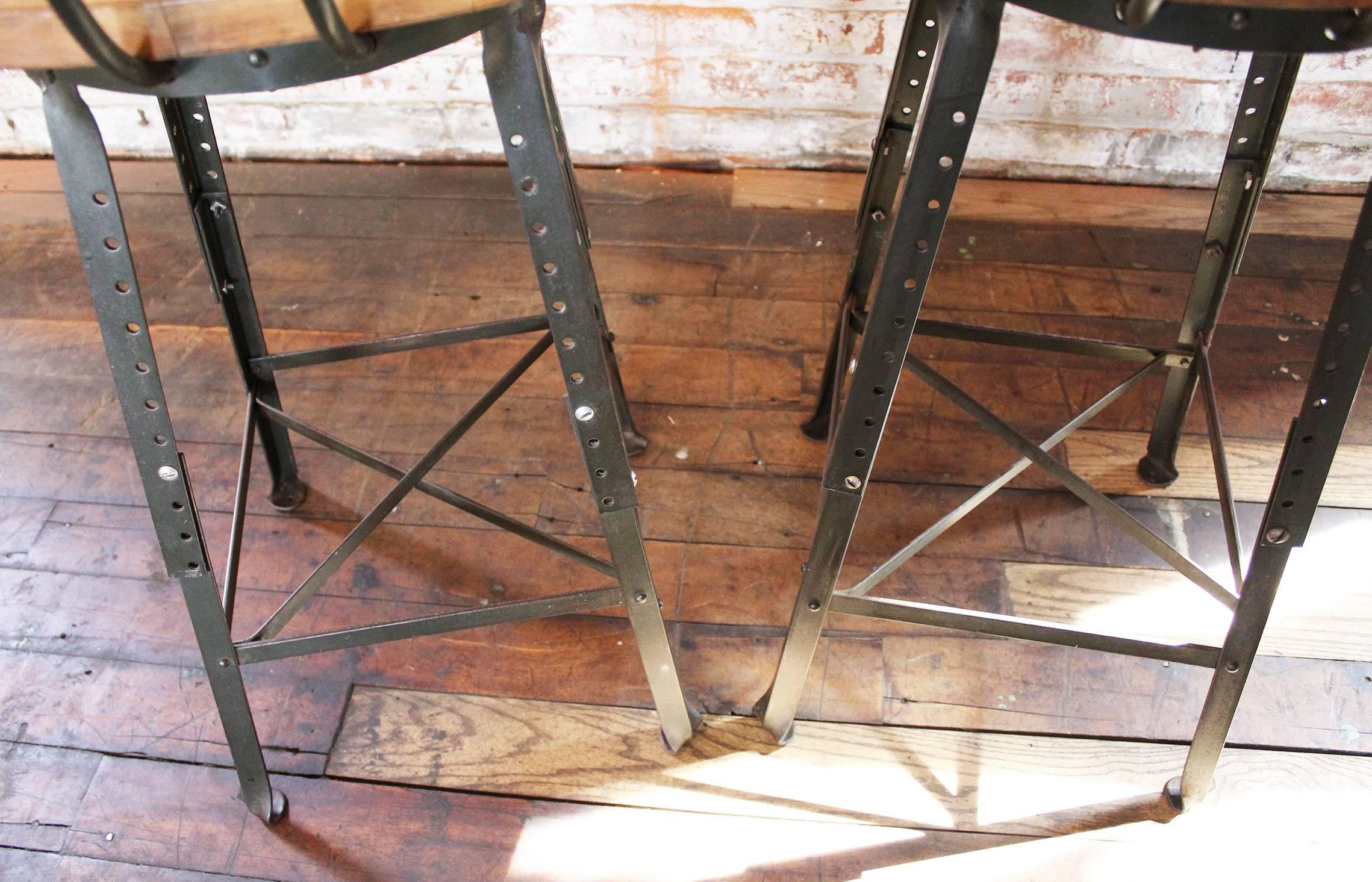 20th Century Pair of Vintage Industrial Adjustable Wood and Metal Factory Shop Bar Stools