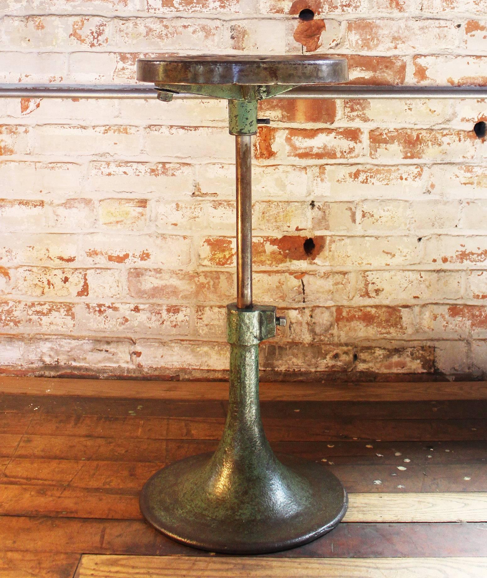 Vintage industrial cast iron and steel backless bar stool. Measures: Seat diameter measures 11 1/2