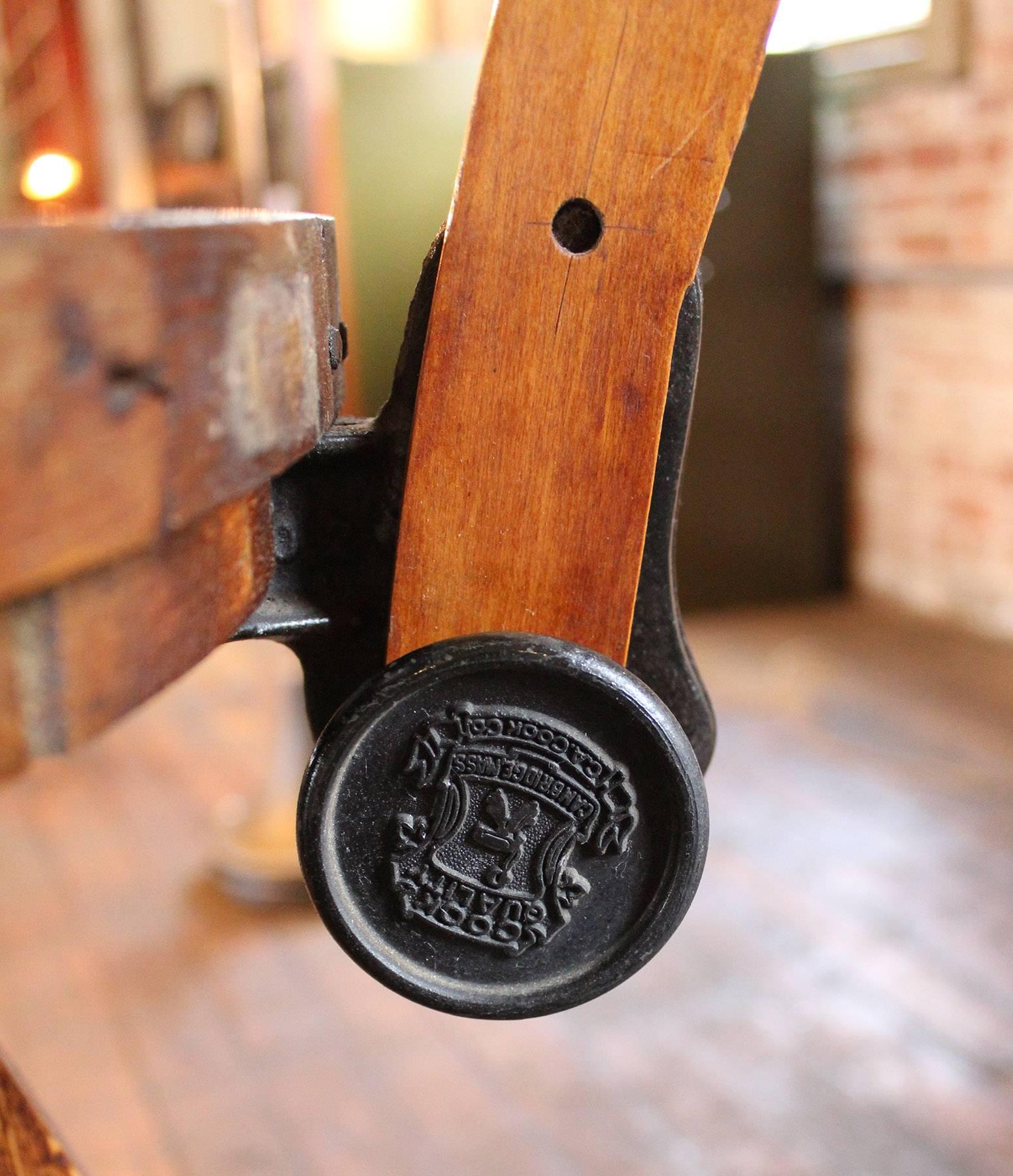 Vintage Industrial Wood and Cast Iron Adjustable Drafting Bar Stool Made by Cook In Good Condition In Oakville, CT