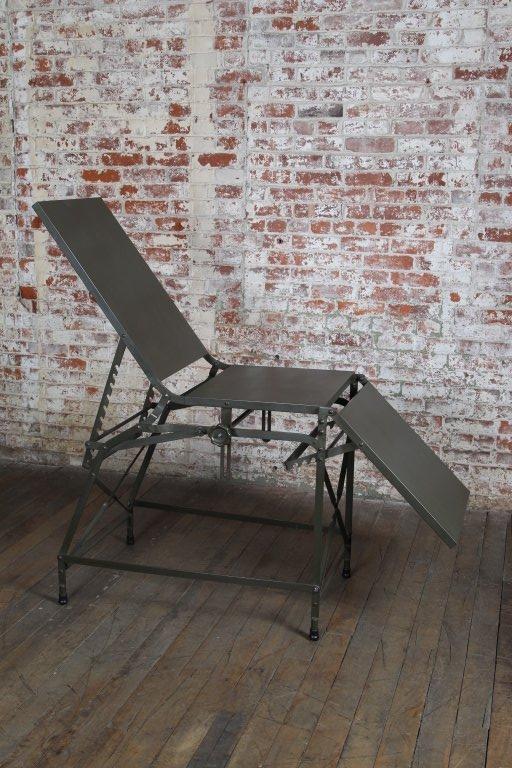 Original, vintage Industrial, American made, adjustable military first aid medical folding portable table bed in original army green paint.