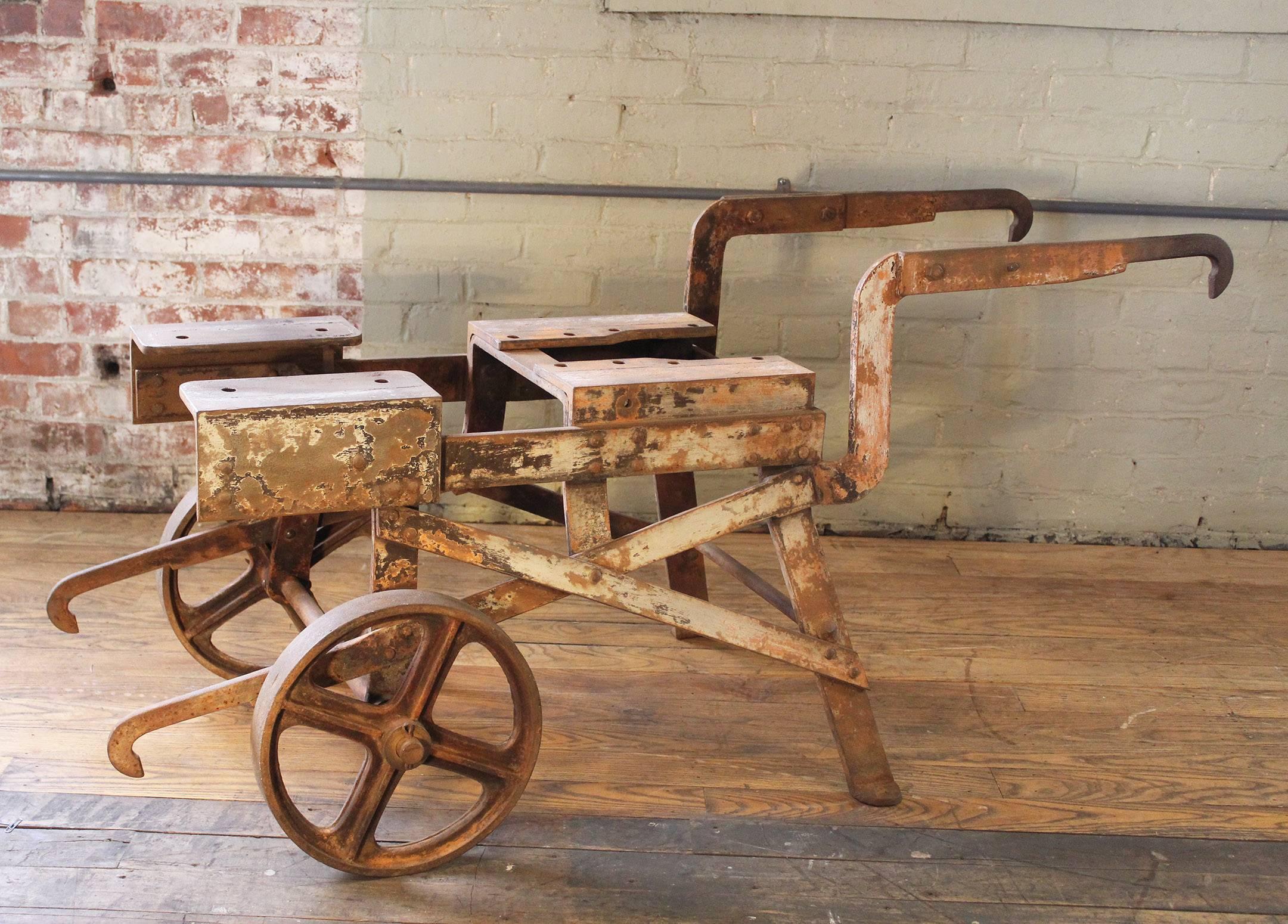 Industrial vintage Outdoor Architectural Object Art factory shop Machine Age steel and metal rolling bar cart, table, farm style wheelbarrow. Overall dimensions are 55 1/2" x 25 1/2" x 25 1/4". Top measures 15 3/4" x 28