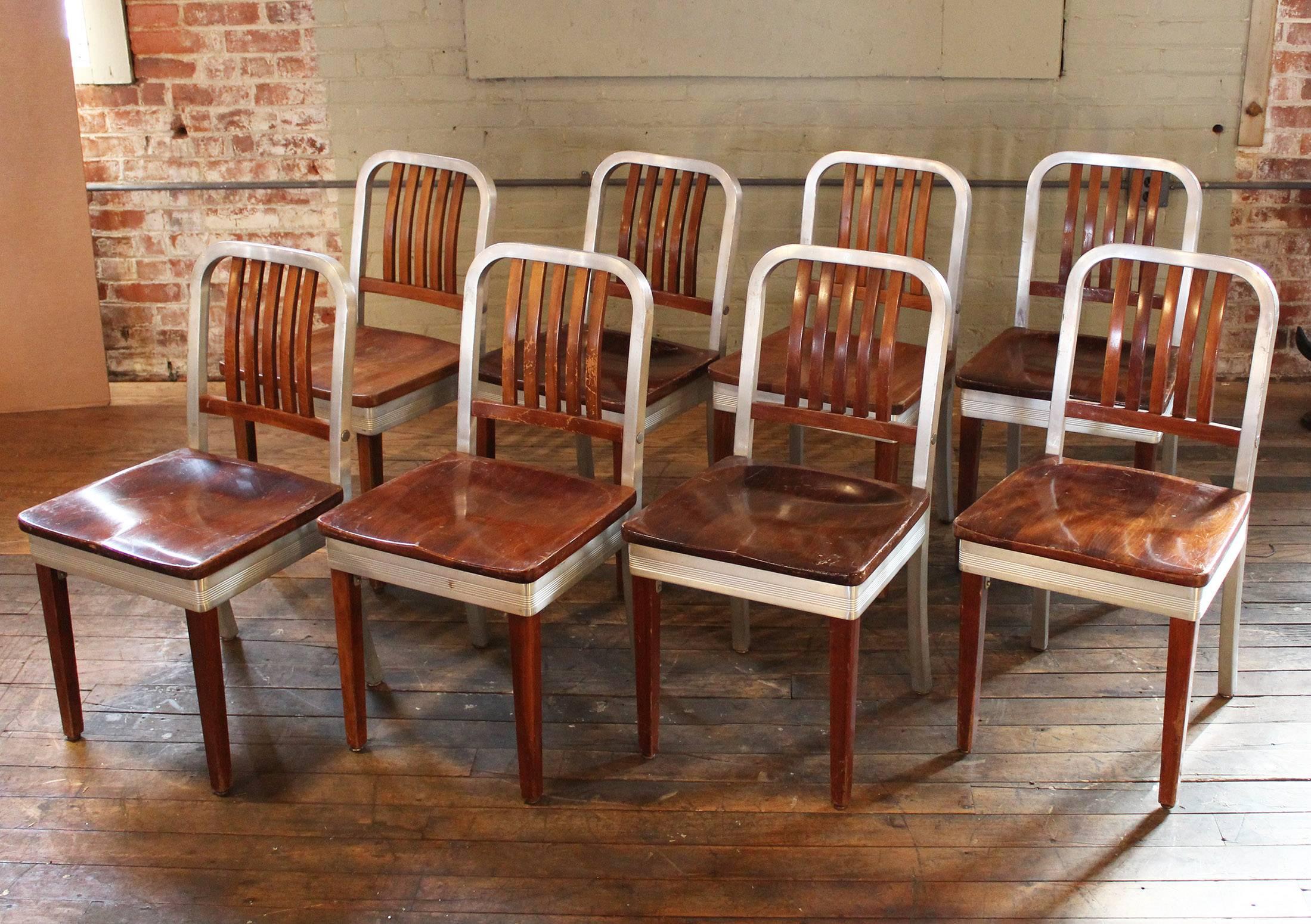 Set of eight vintage wood and metal, aluminium side Shaw Walker dining chairs. Good condition, Professionally repaired structurally. Please view photos for specific wear.
