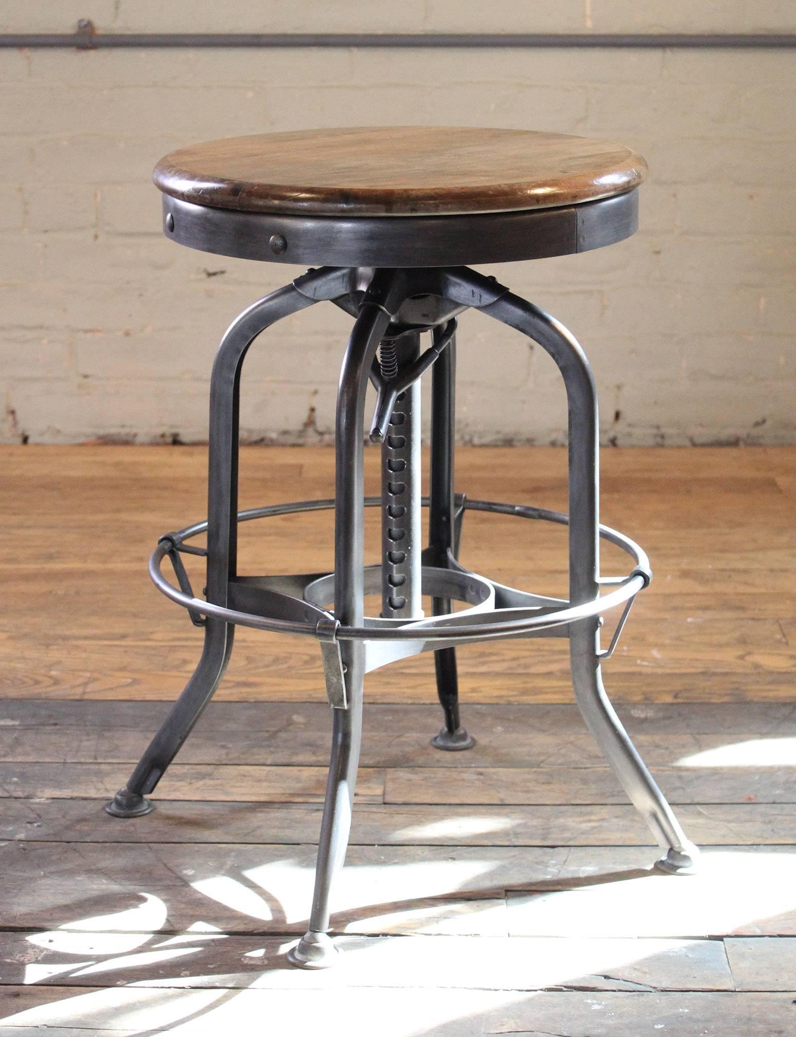 Original vintage Industrial Toledo backless wood and metal adjustable bar stool. Seat height is adjustable from 28 1/2
